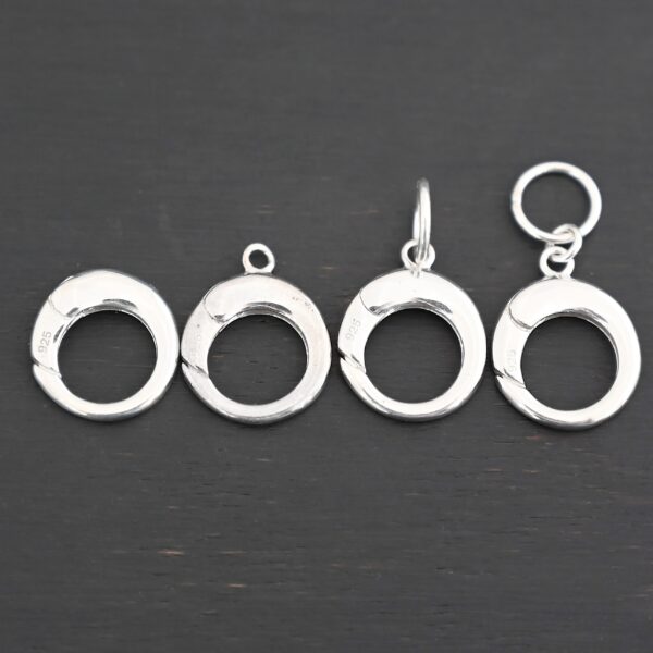 Pearl Push Clasp - large shiny shown on dark background