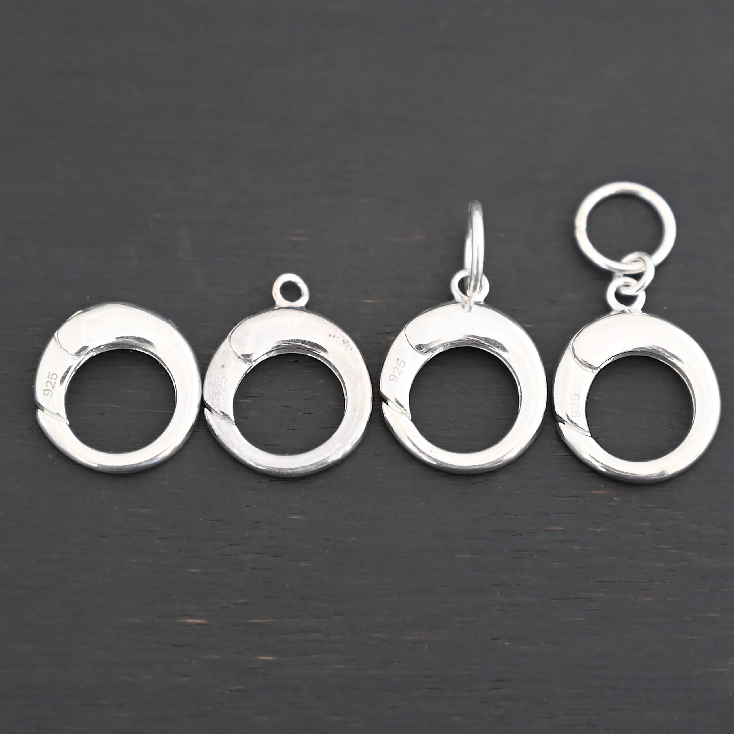 Pearl Push Clasp - large shiny shown on dark background