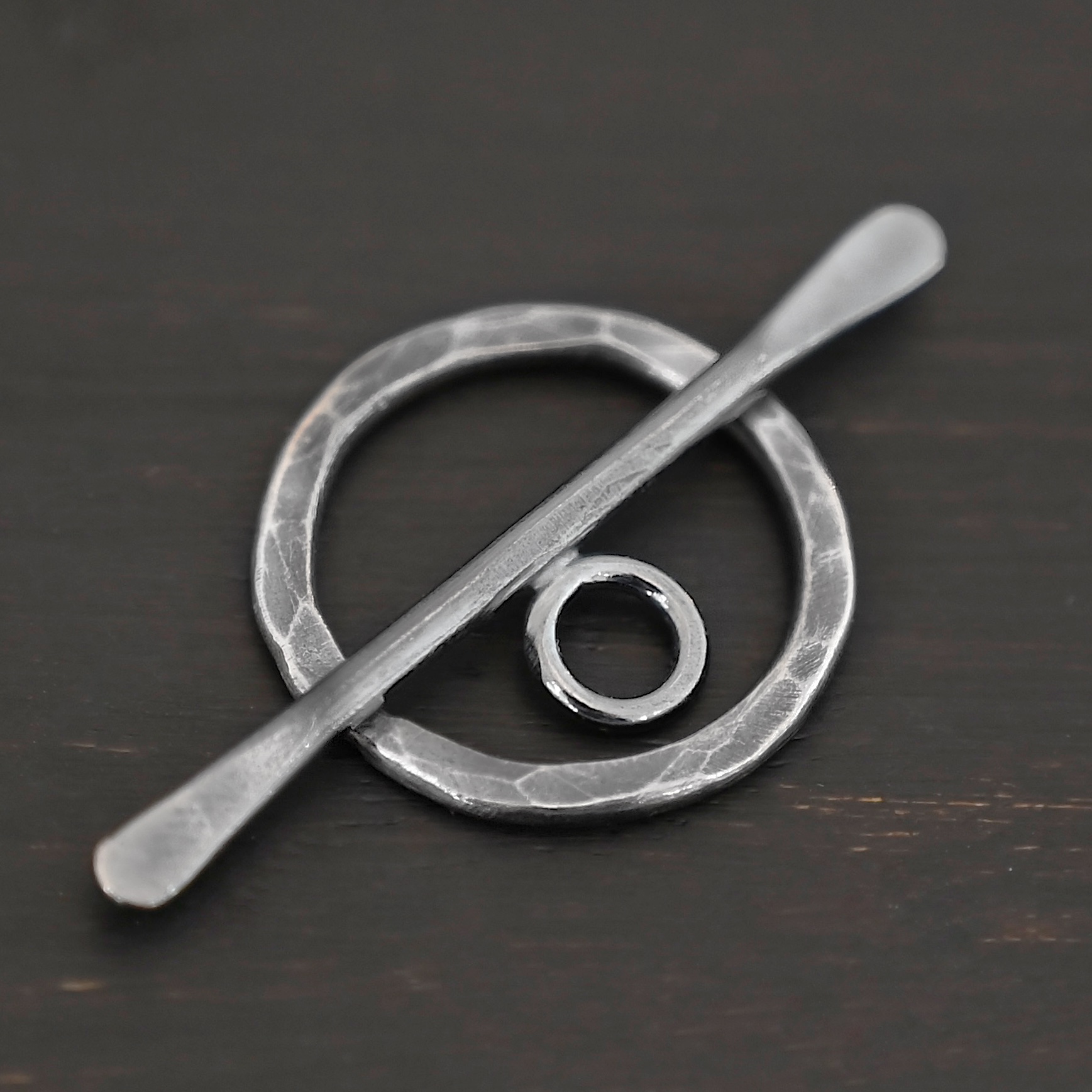 Tessa Toggle Clasp shown on dark background