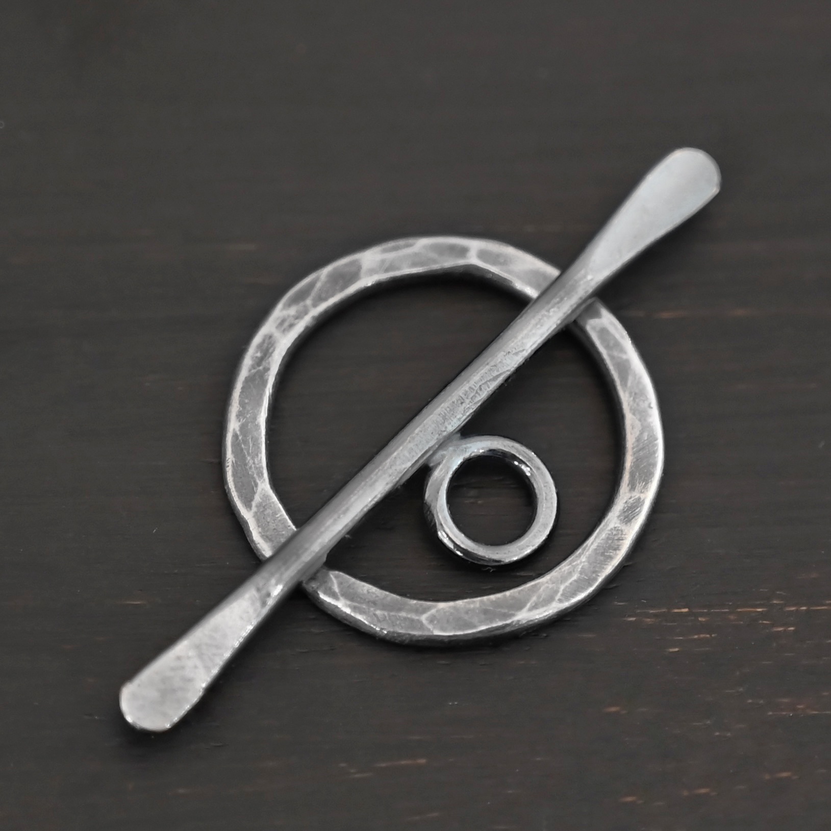 Tessa Toggle Clasp shown on dark background