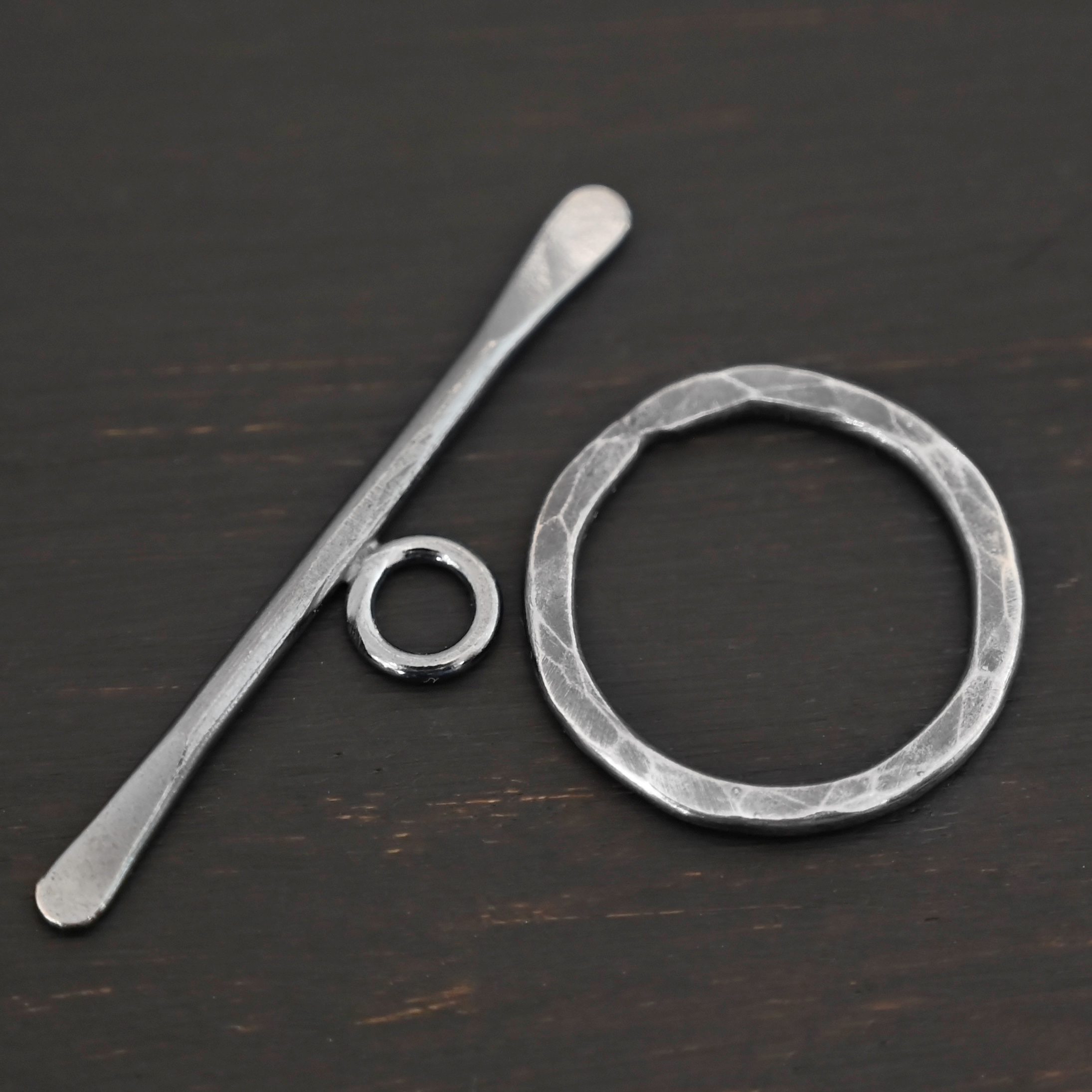 Tessa Toggle Clasp shown on dark background