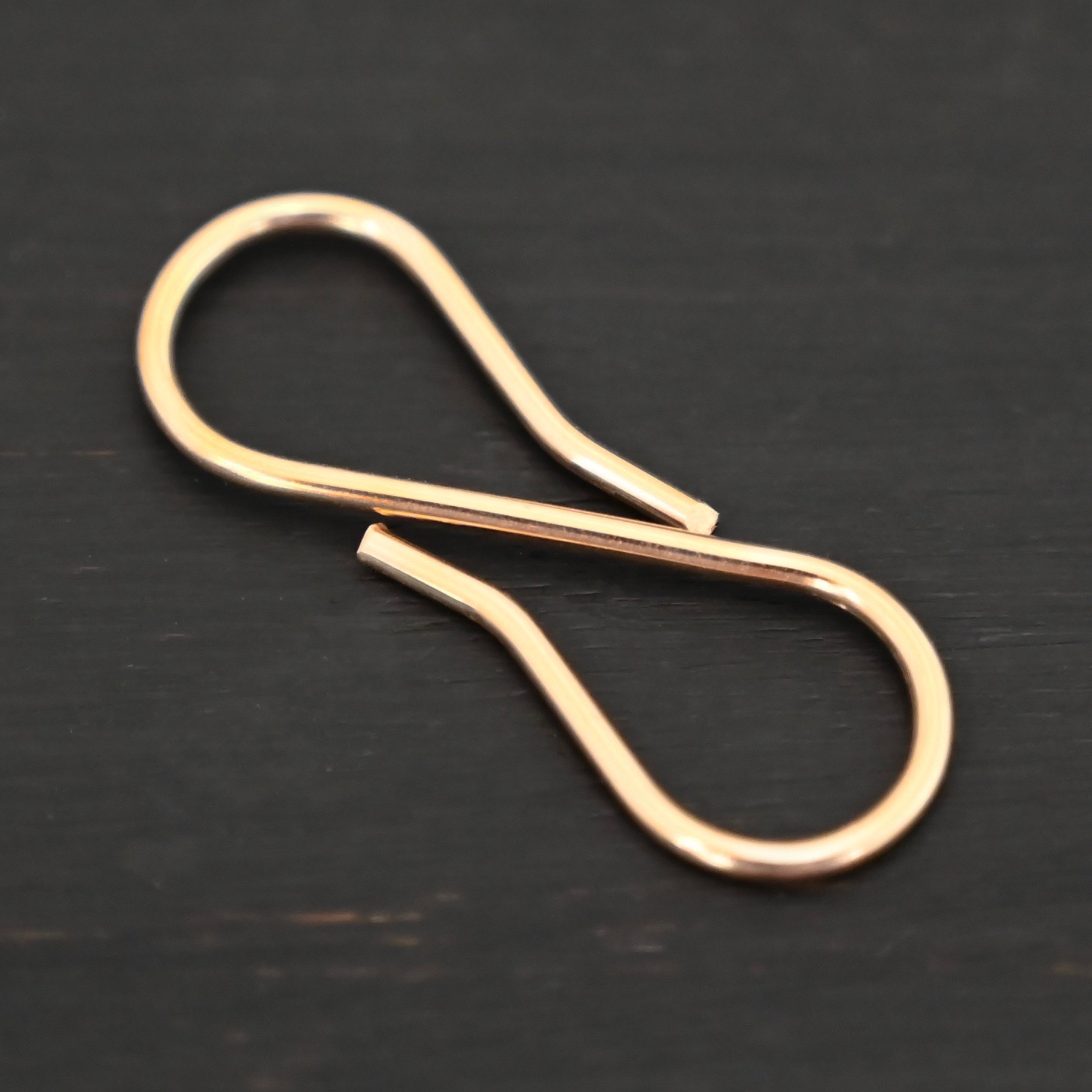 Stella 14k GF S Clasp shown on dark background