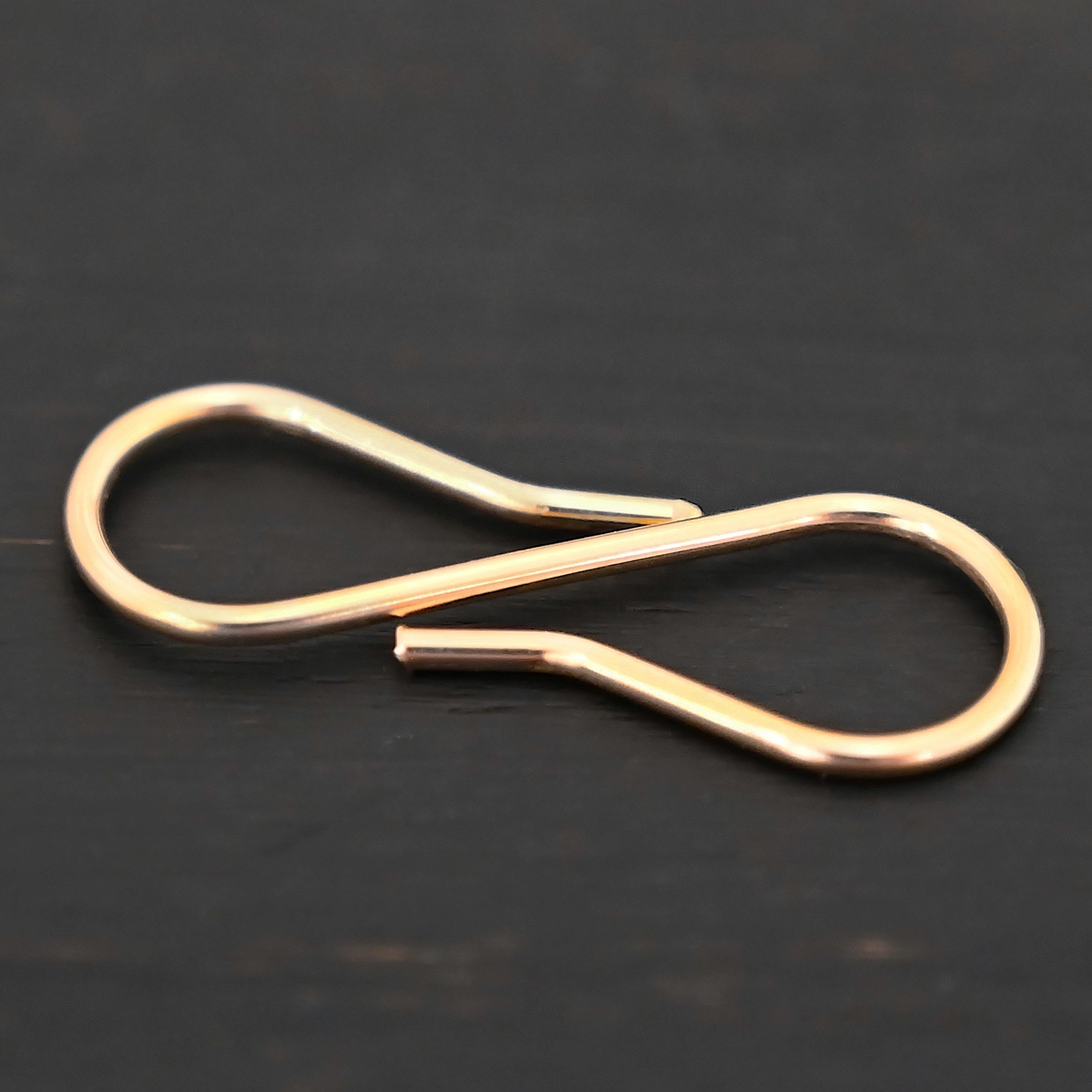 Stella 14k GF S Clasp shown on dark background