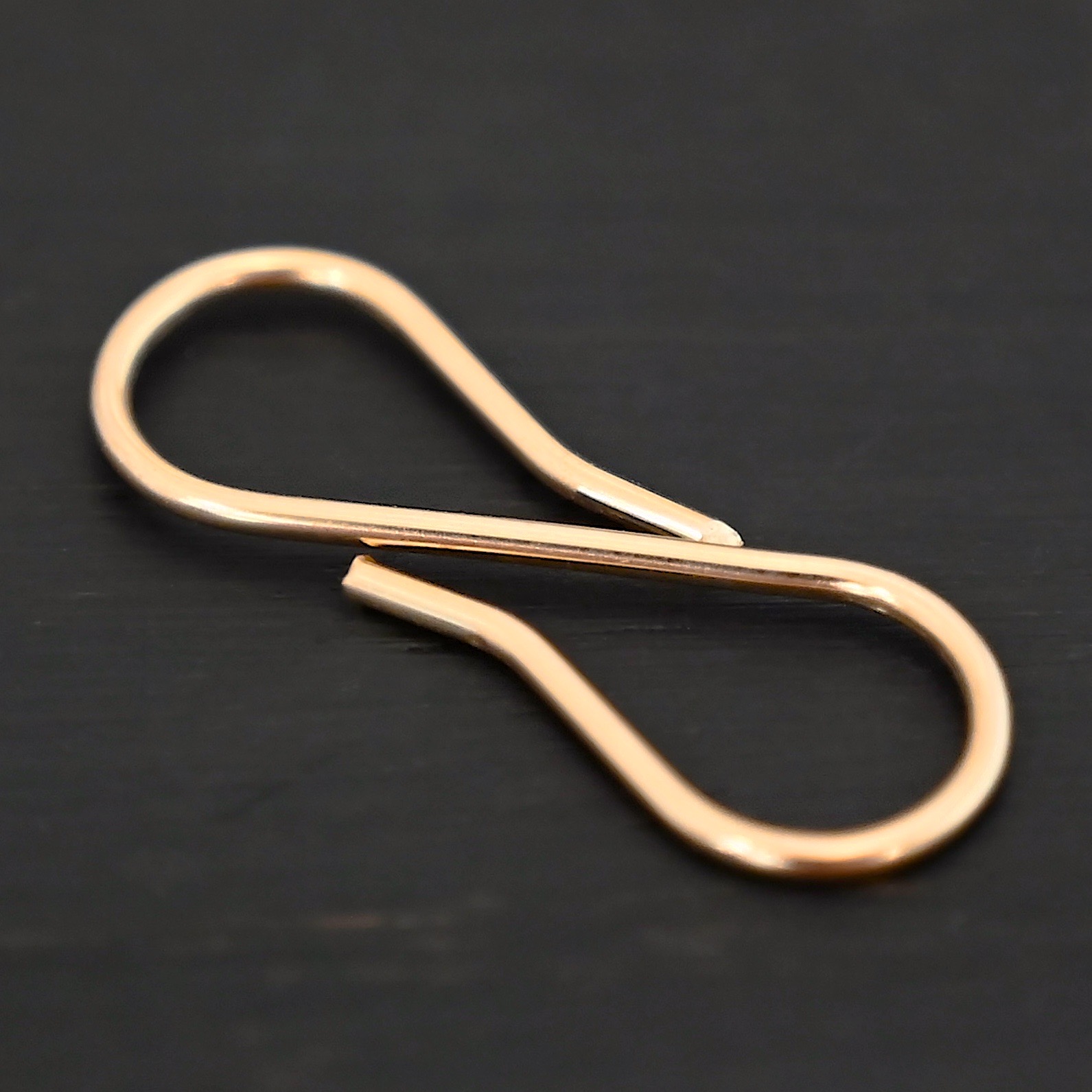 Stella 14k GF S Clasp shown on dark background