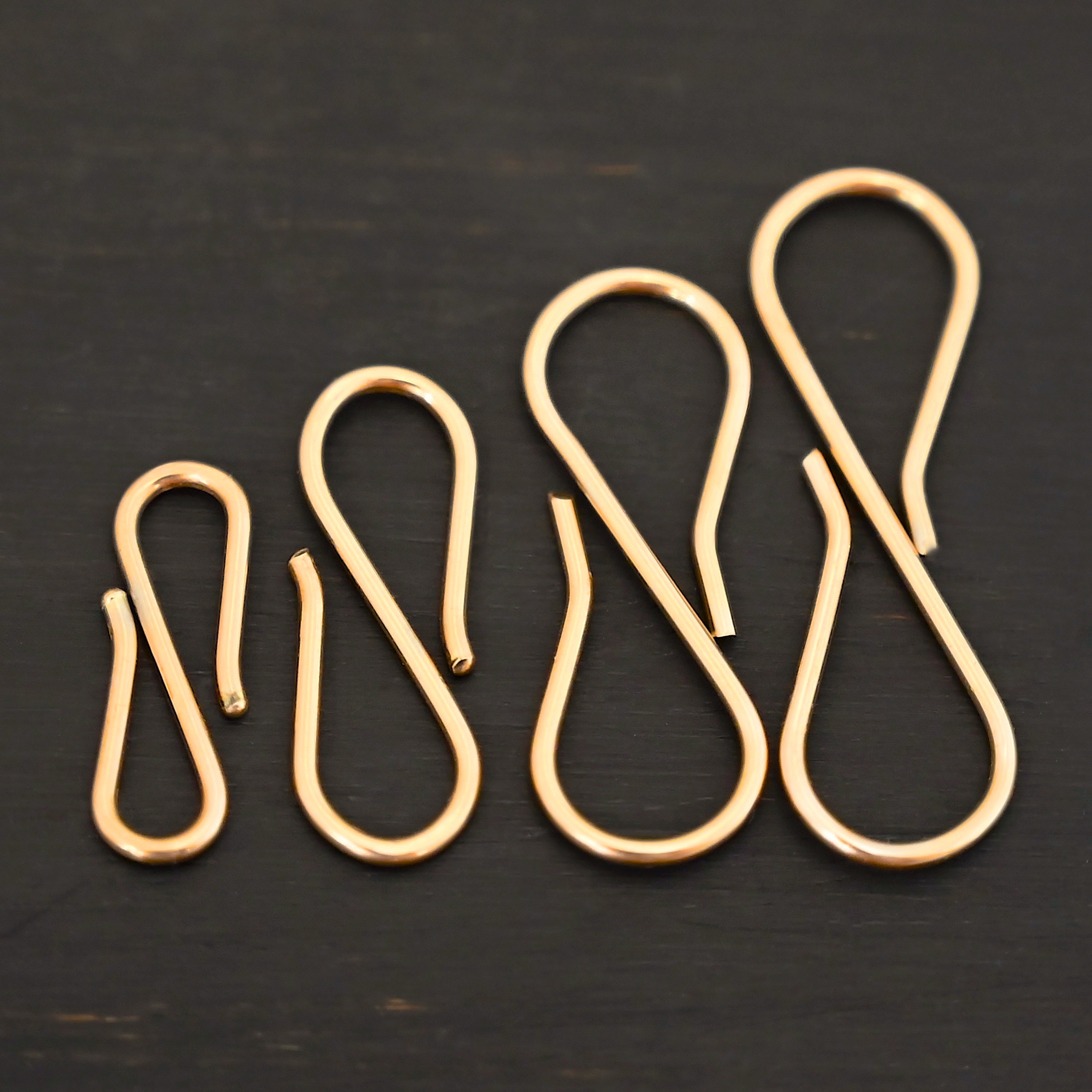 Stella 14k GF S Clasp shown on dark background