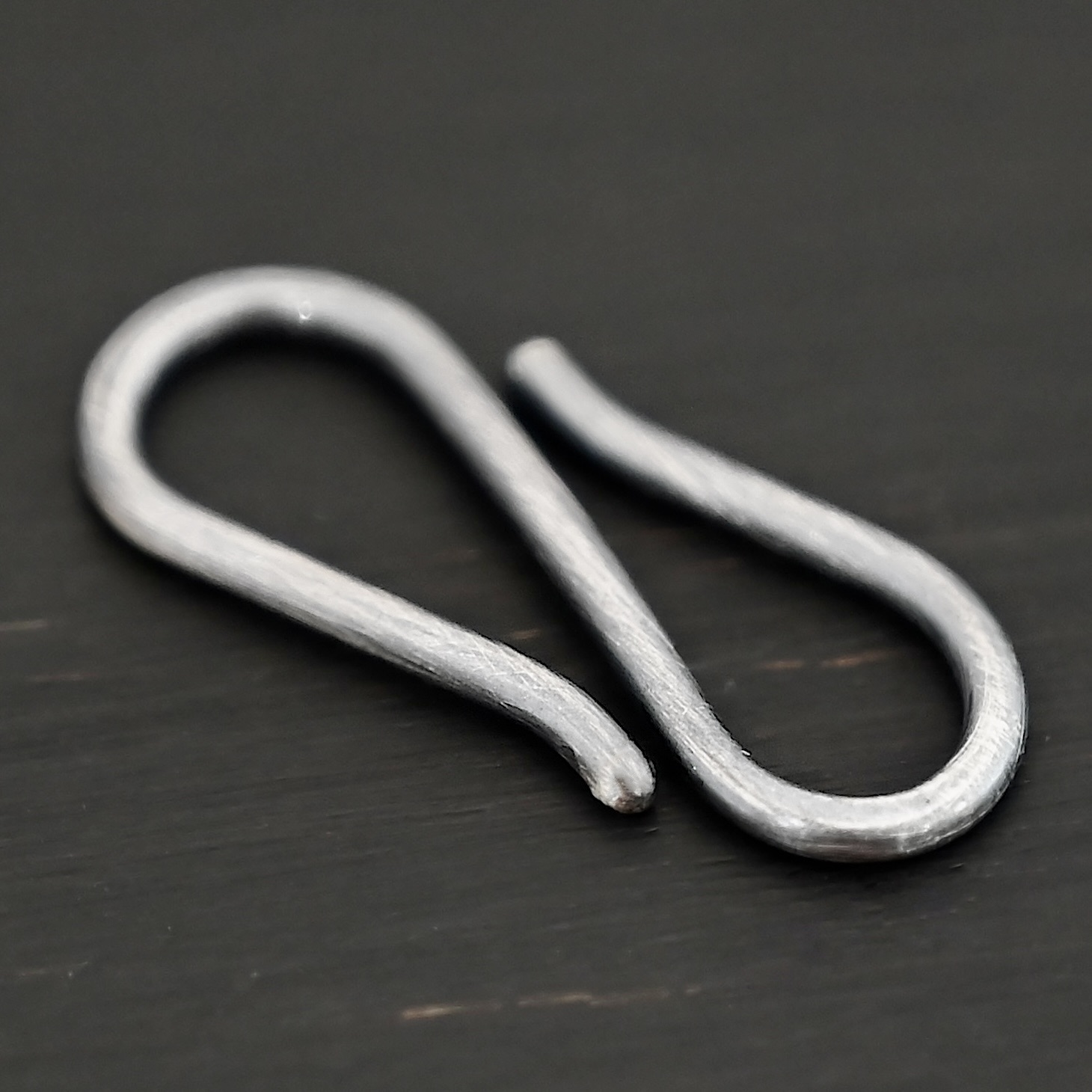 Simon S Clasp - oxidized Simon S Clasp - oxidized shown on dark background