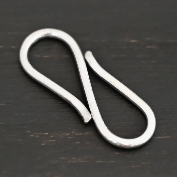 Simon S Clasp - shiny shown on dark background