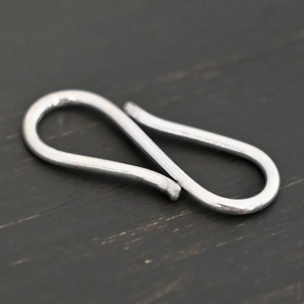 Simon S Clasp - shiny shown on dark background