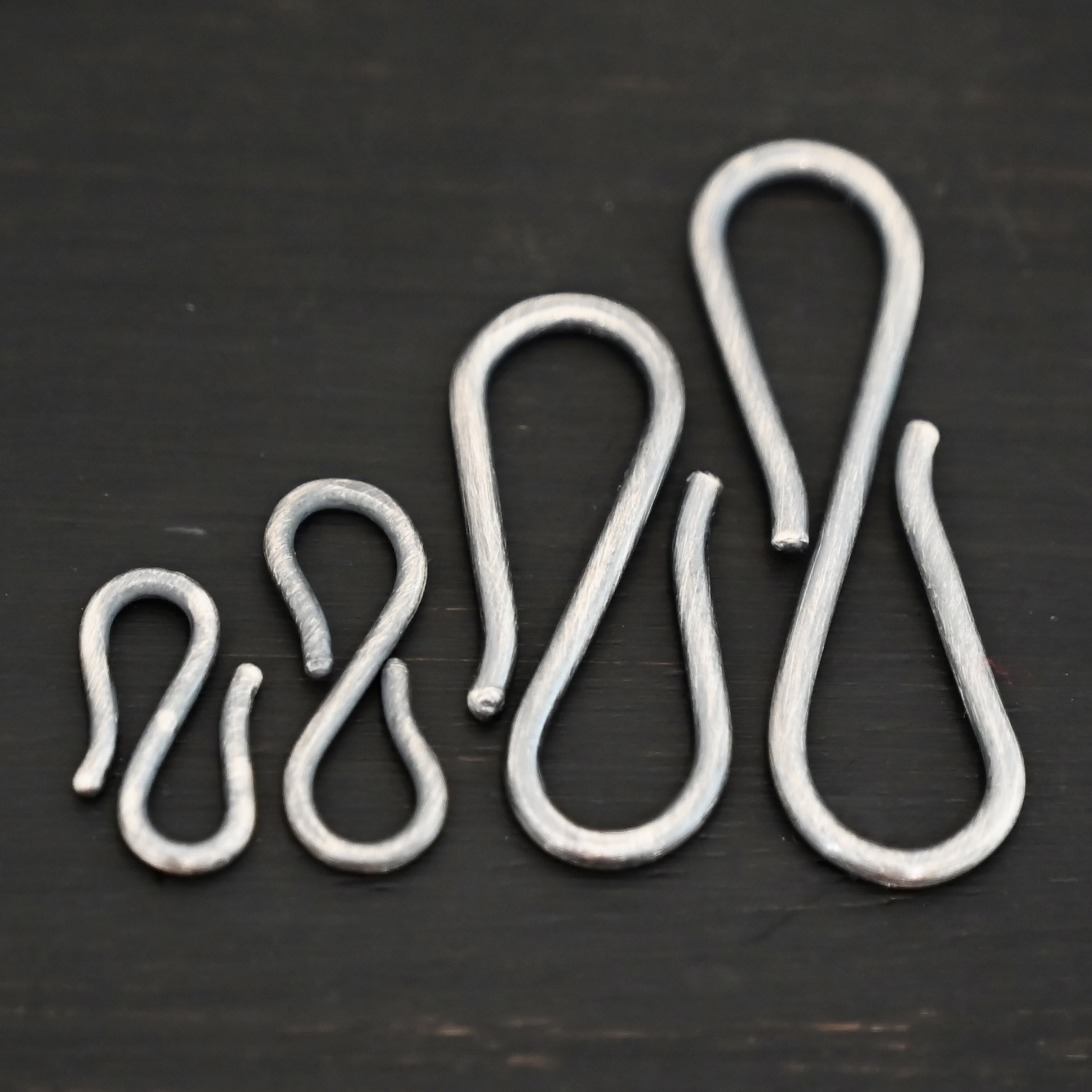 Simon S Clasp - oxidized Simon S Clasp - oxidized shown on dark background