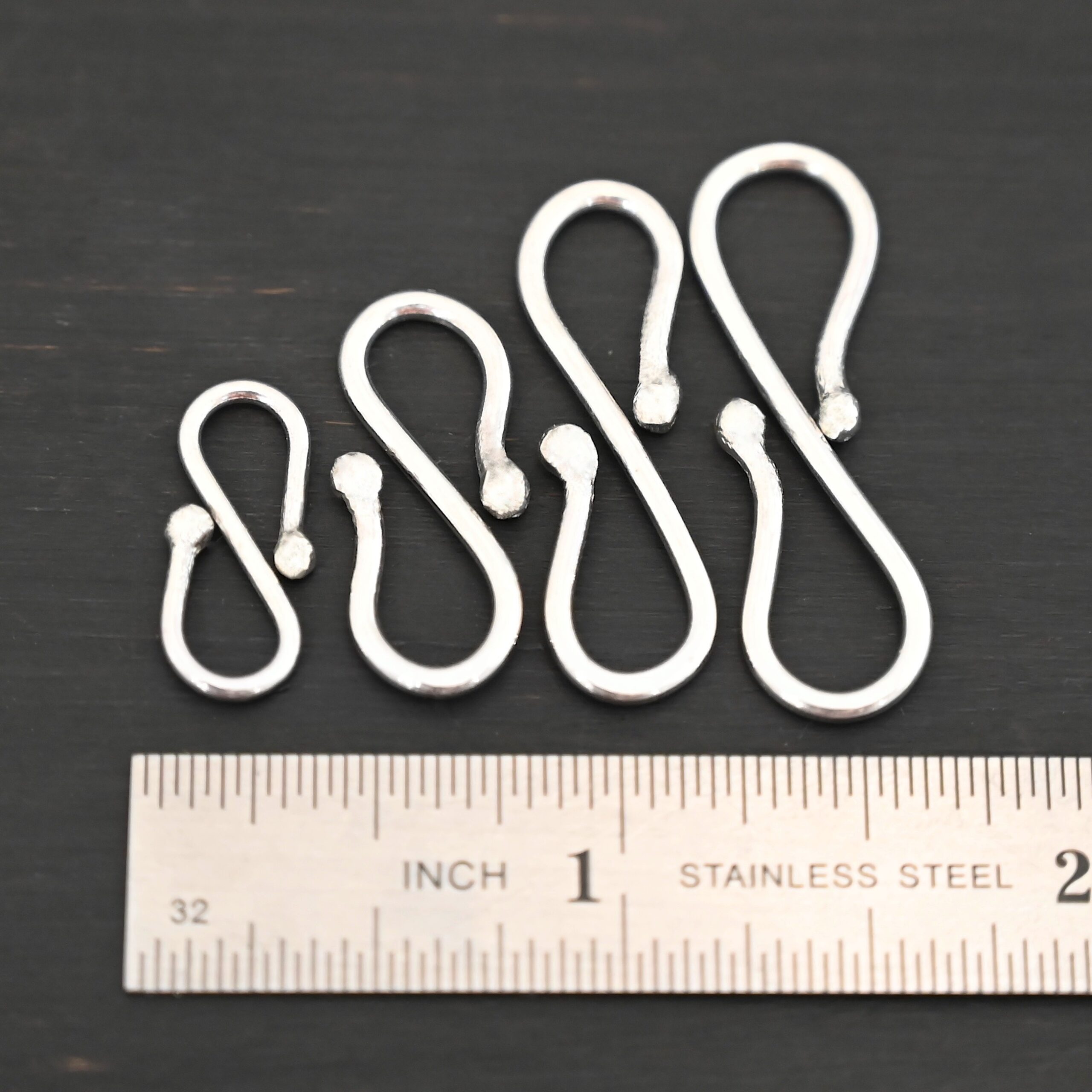 Saint S Clasp - shiny shown by ruler