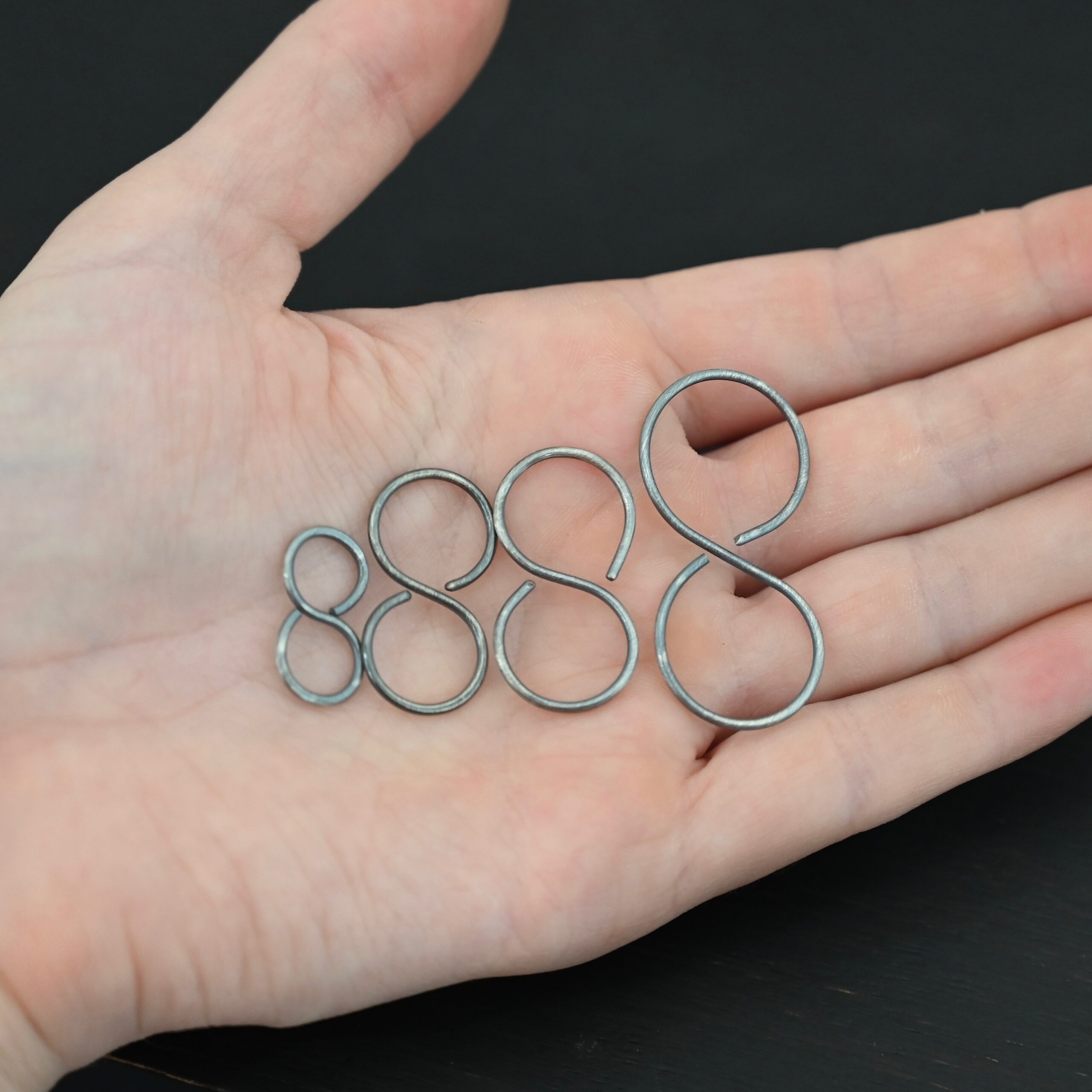 Sienna S Clasp - oxidized shown in hand