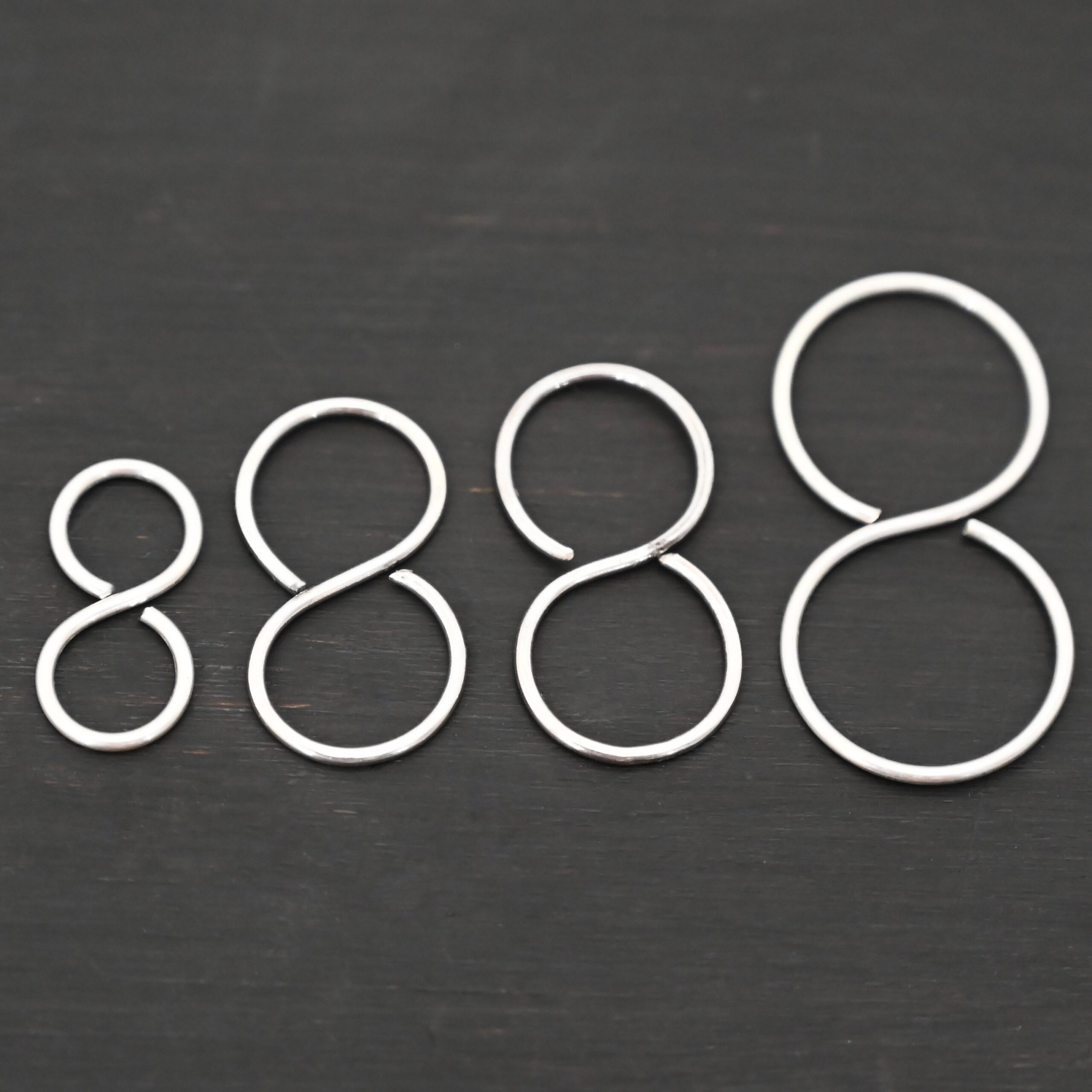 Sienna S Clasp - shiny shown on dark background