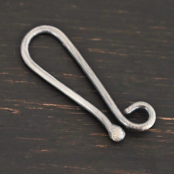 Hazel Hook Clasp - oxidized shown on dark background