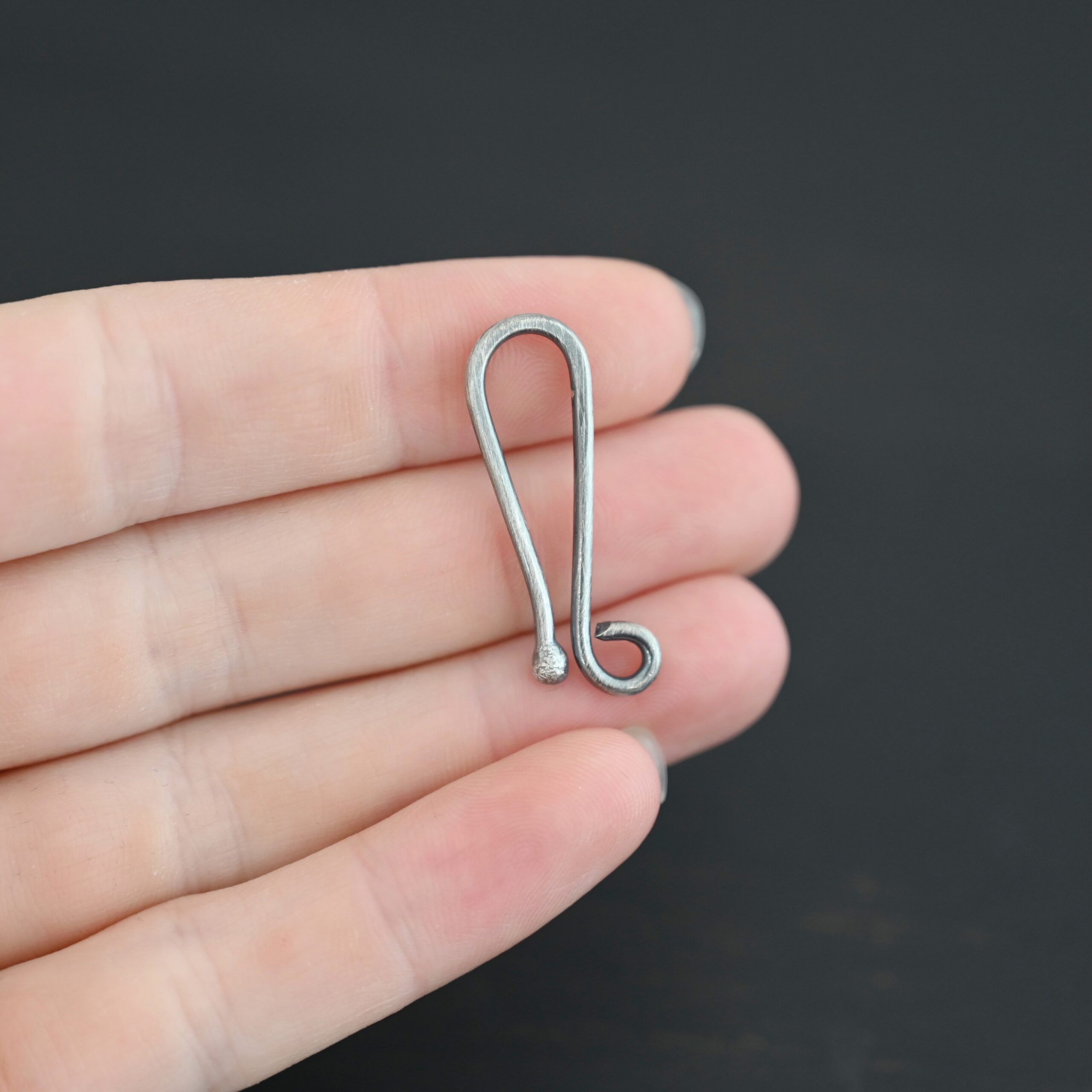 Hazel Hook Clasp - oxidized shown in hand