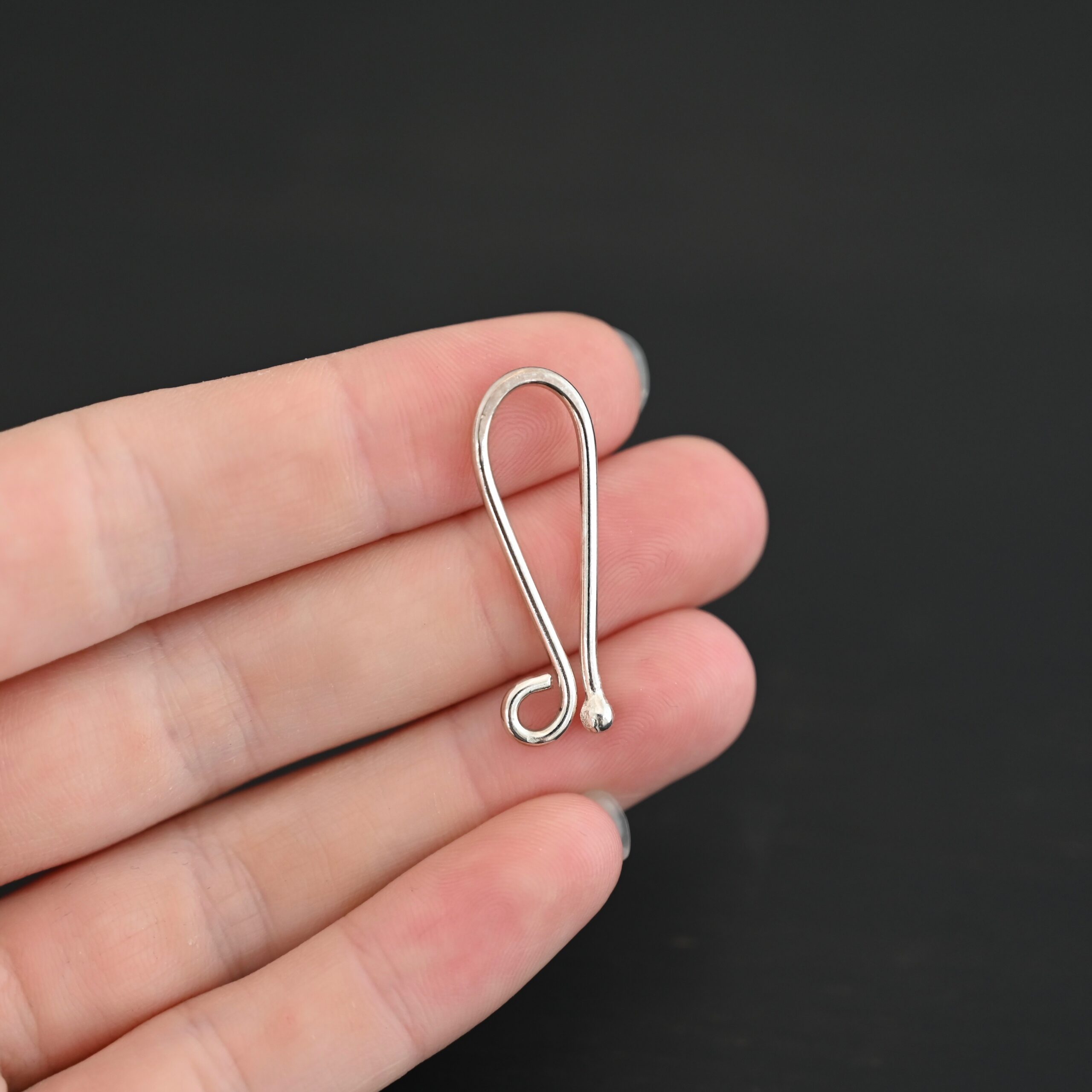 Hazel Hook Clasp - shiny shown in hand