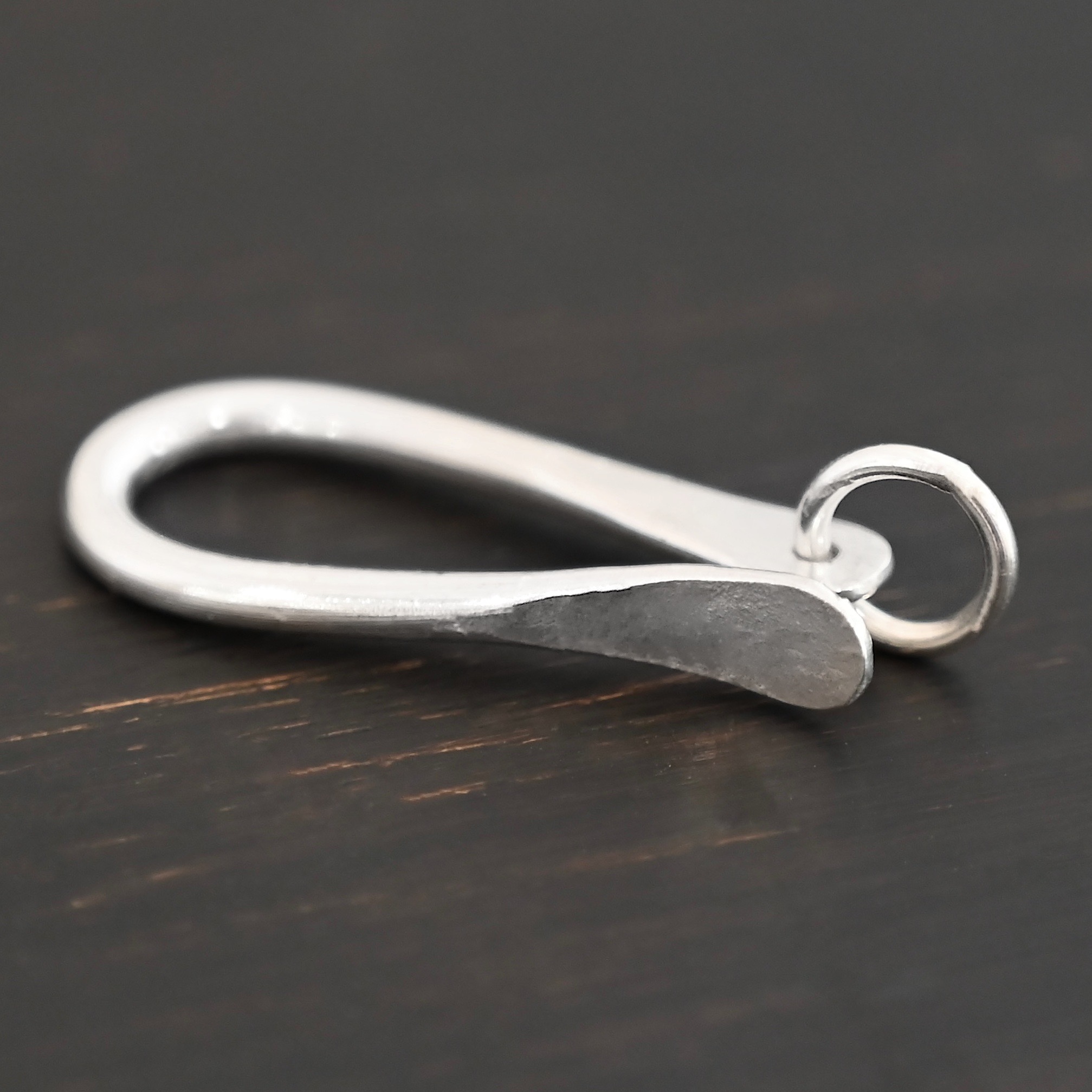 Harrison Hook Clasp - shiny Harrison Hook Clasp - shiny shown on dark background