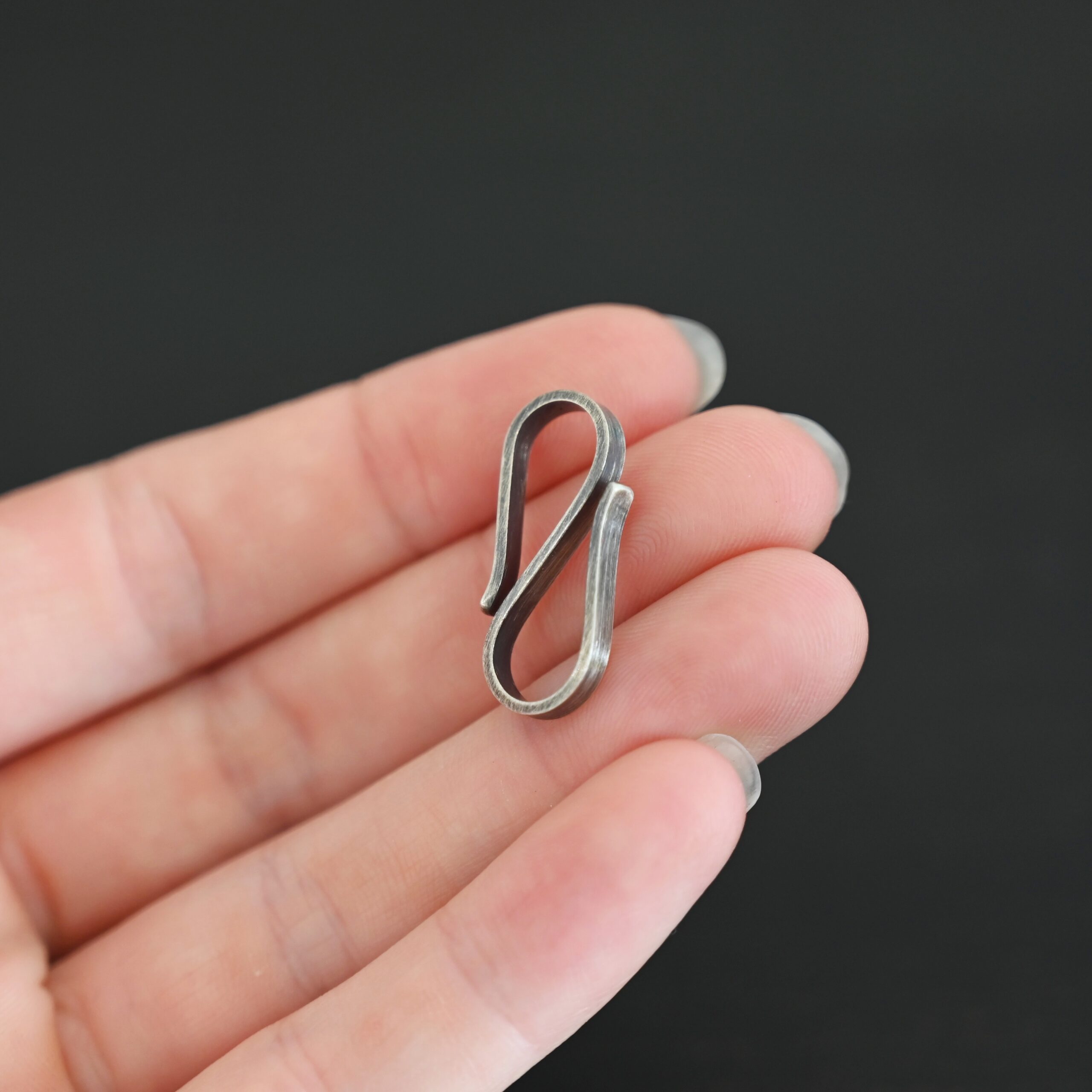 Stetson S Clasp - oxidized shown in hand