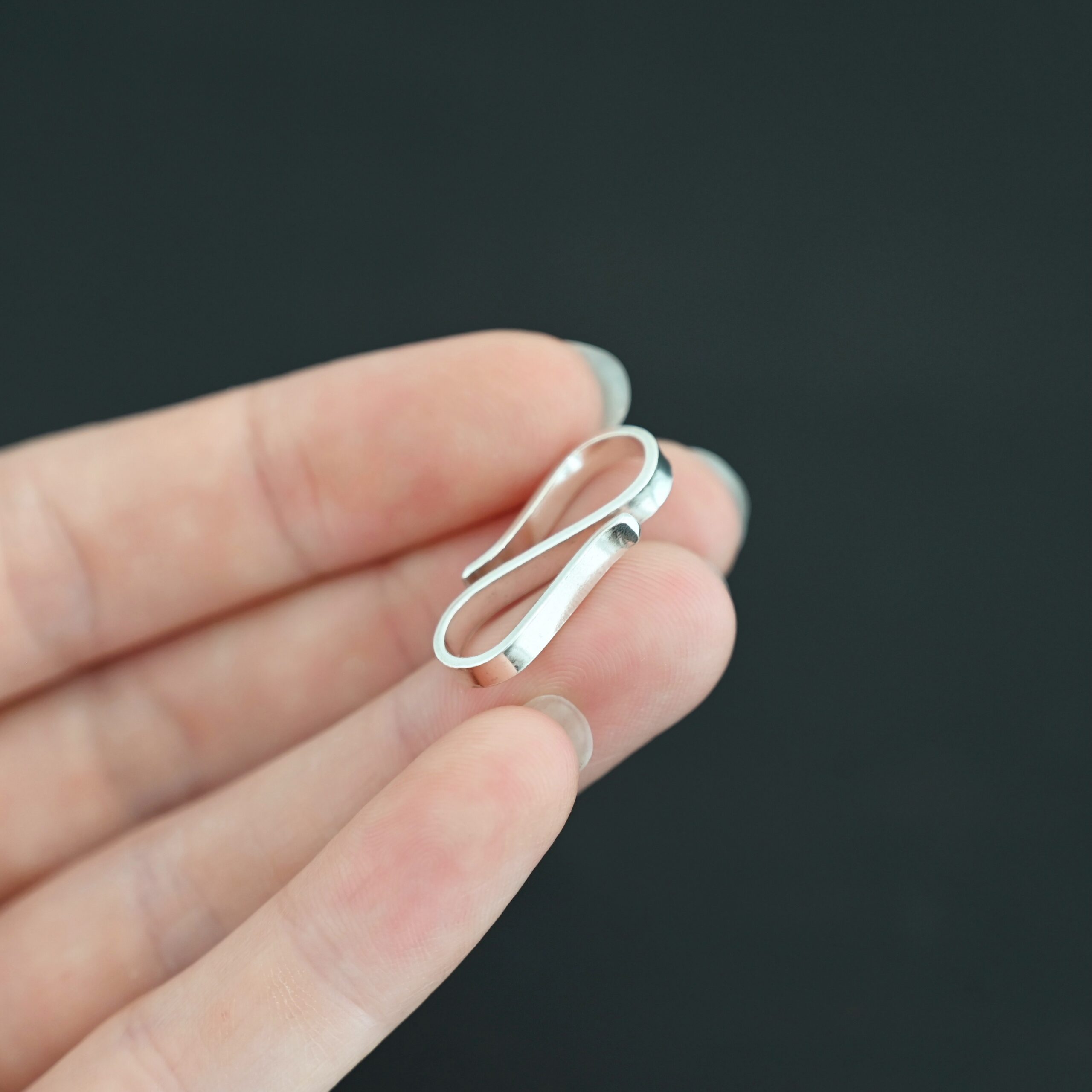 Stetson S Clasp - shiny shown in hand