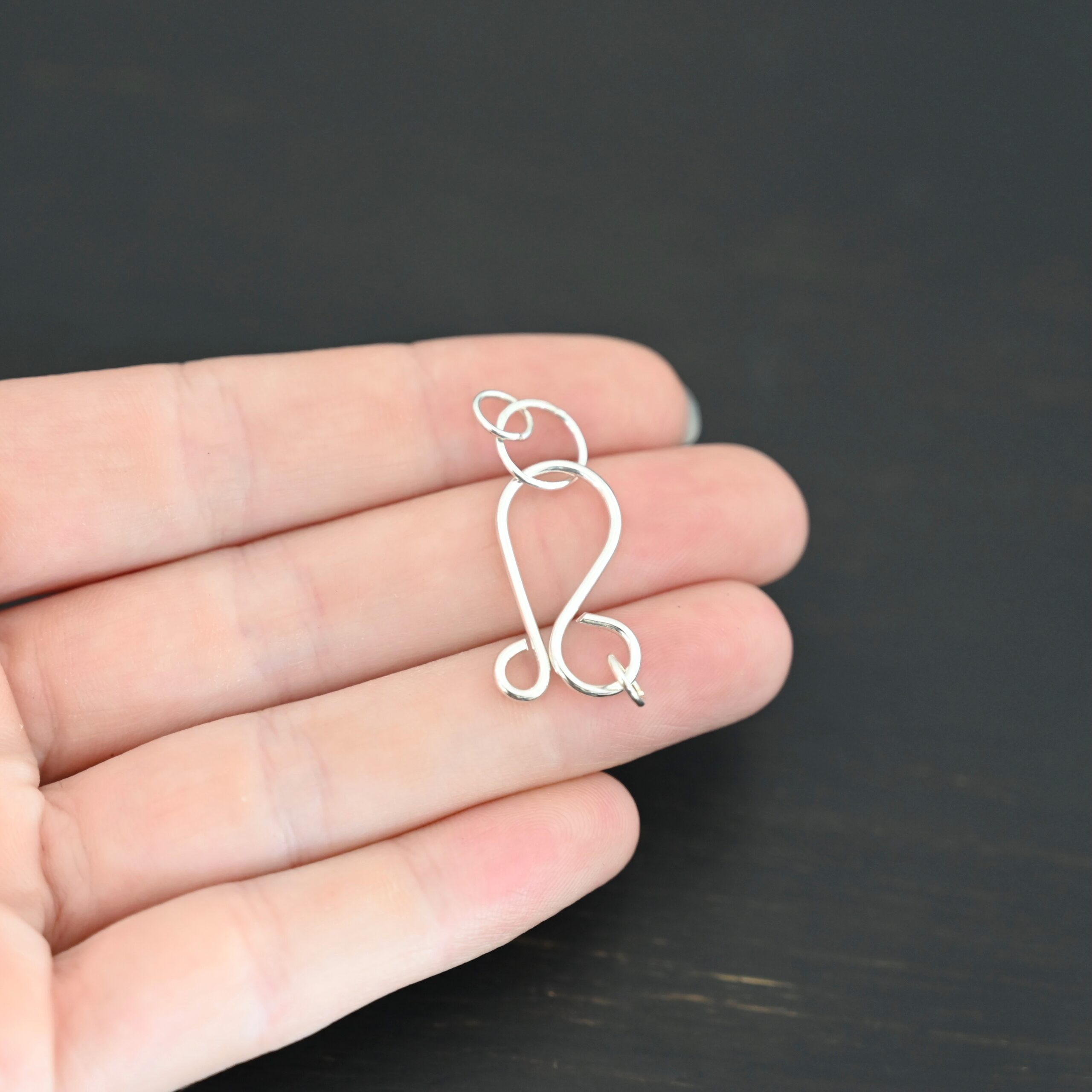 Harmony Hook Clasp - shiny shown in hand