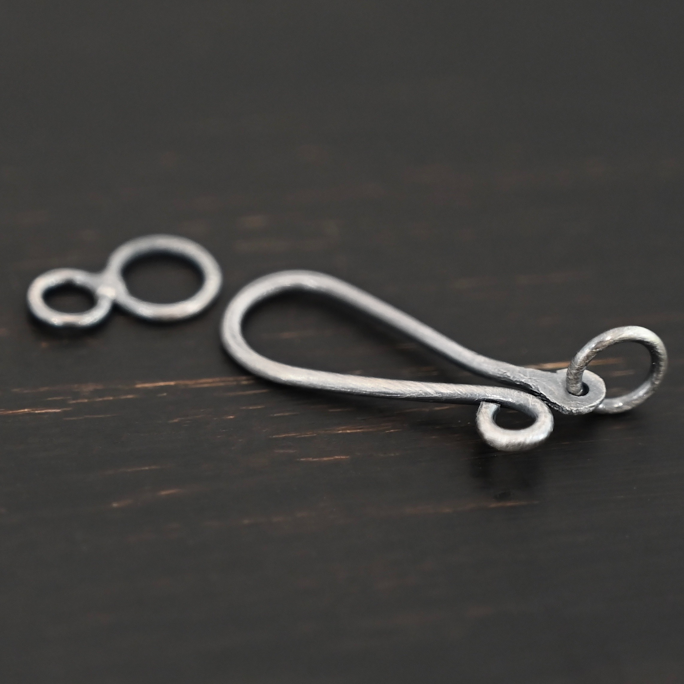 Haylee Hook Clasp - oxidized shown on dark background