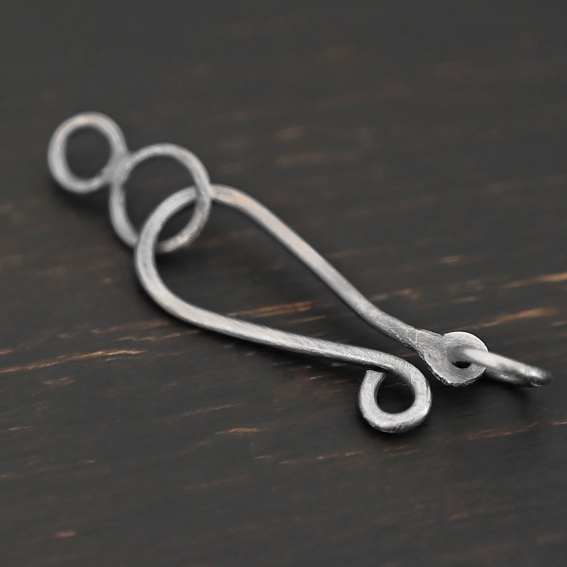 Haylee Hook Clasp - oxidized shown on dark background
