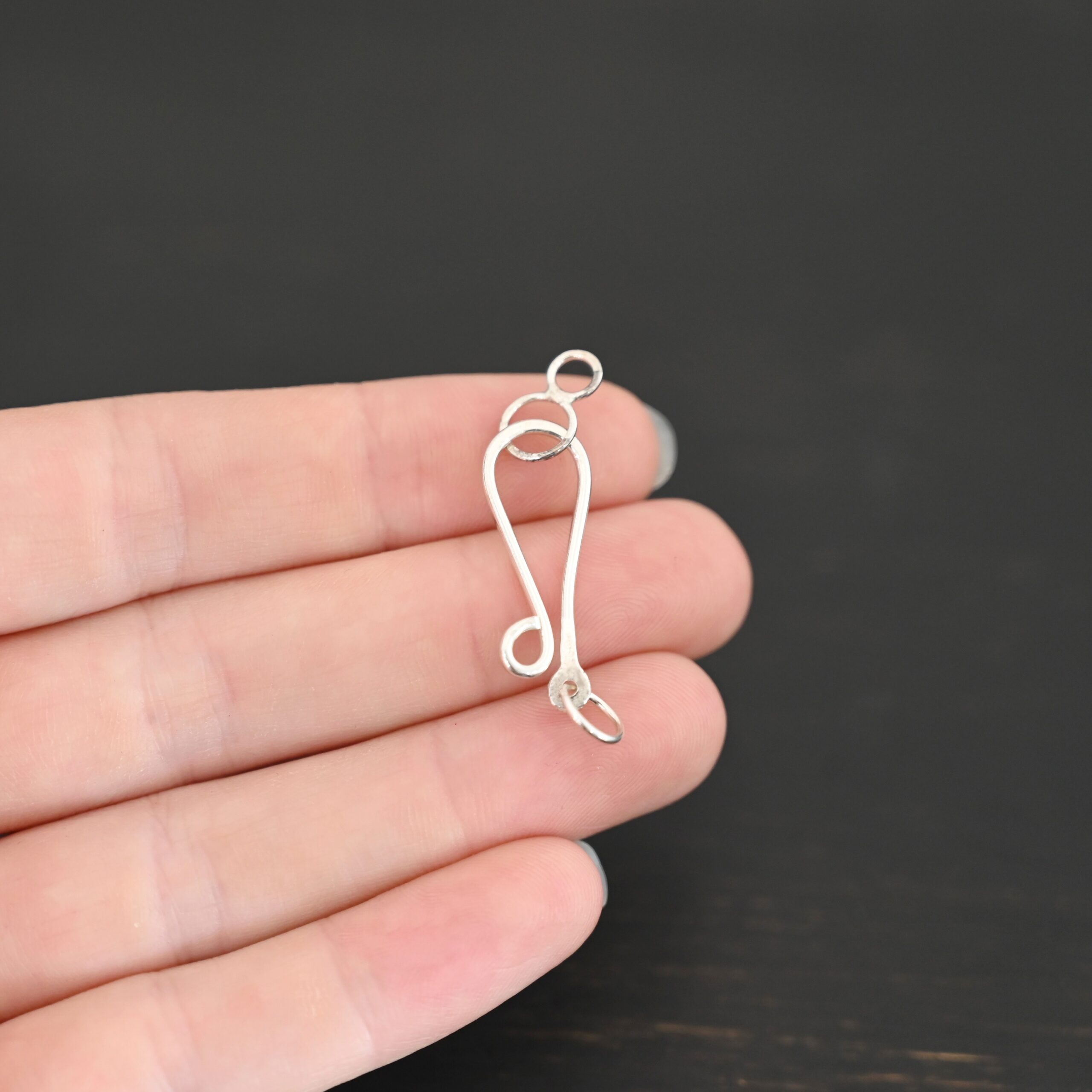 Haylee Hook Clasp - shiny shown in hand