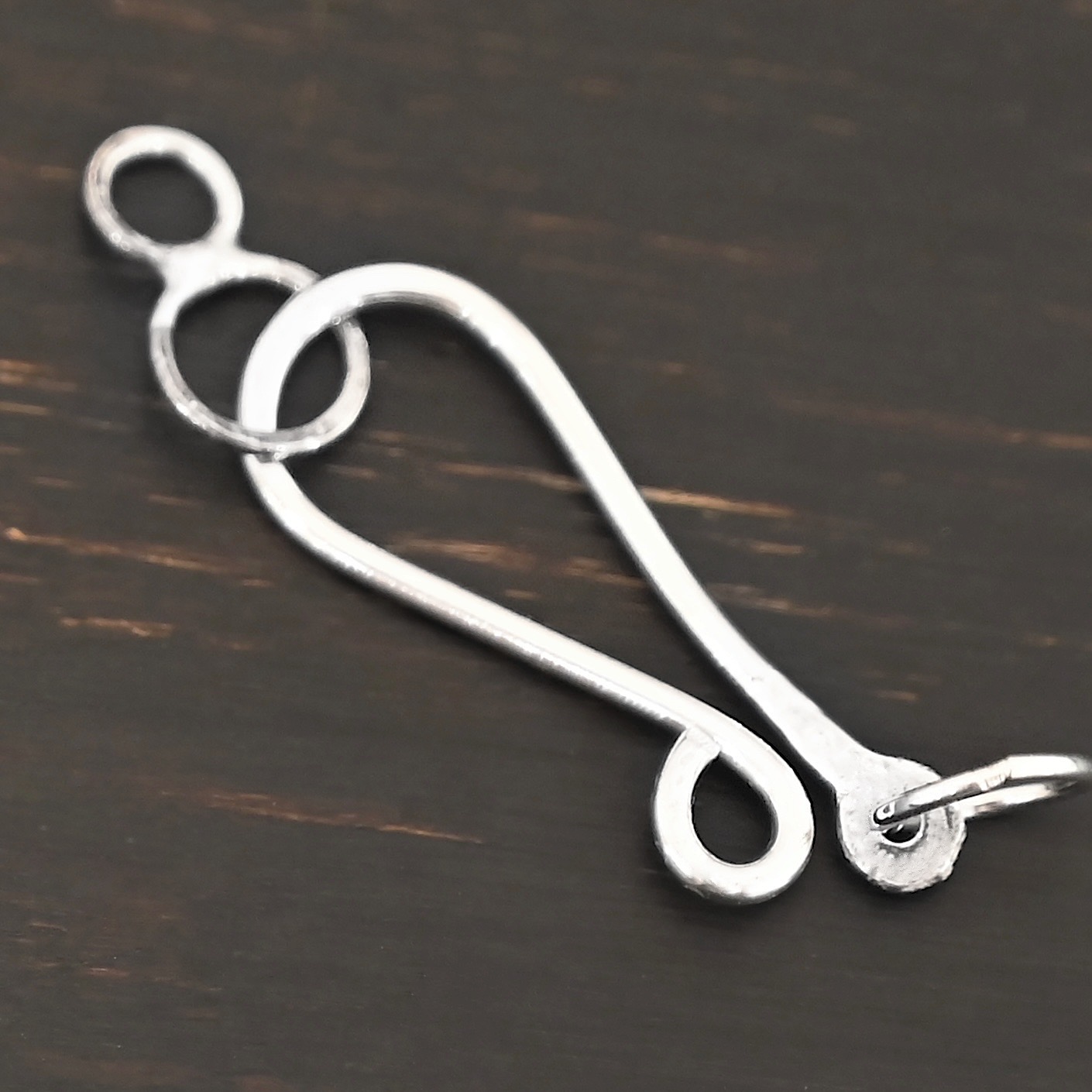 Haylee Hook Clasp - shiny shown on dark background