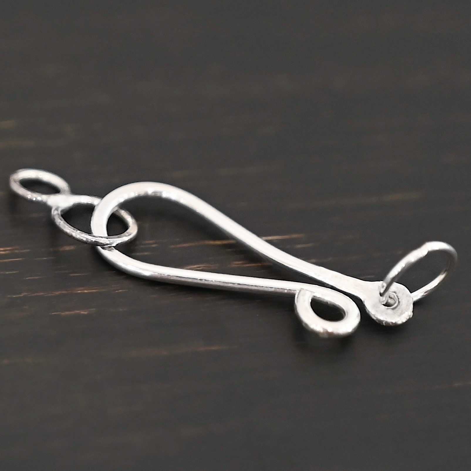 Haylee Hook Clasp - shiny shown on dark background