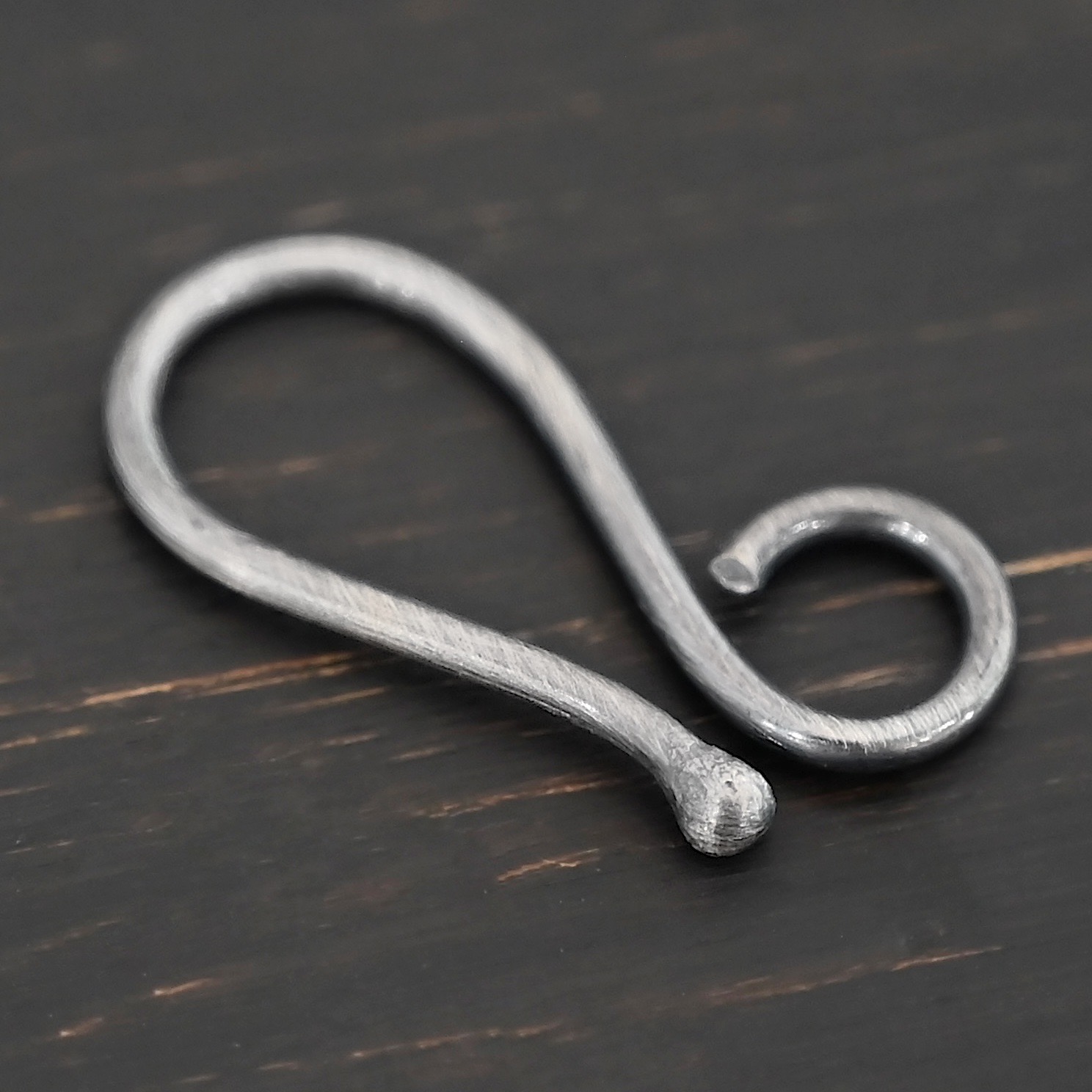 Hendrix Hook Clasp - oxidized shown on dark background