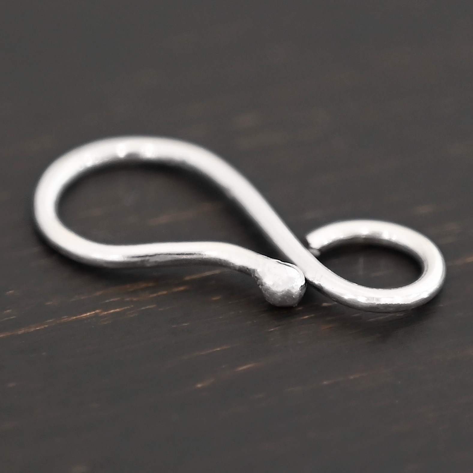 Hendrix Hook Clasp -shiny shown on dark background