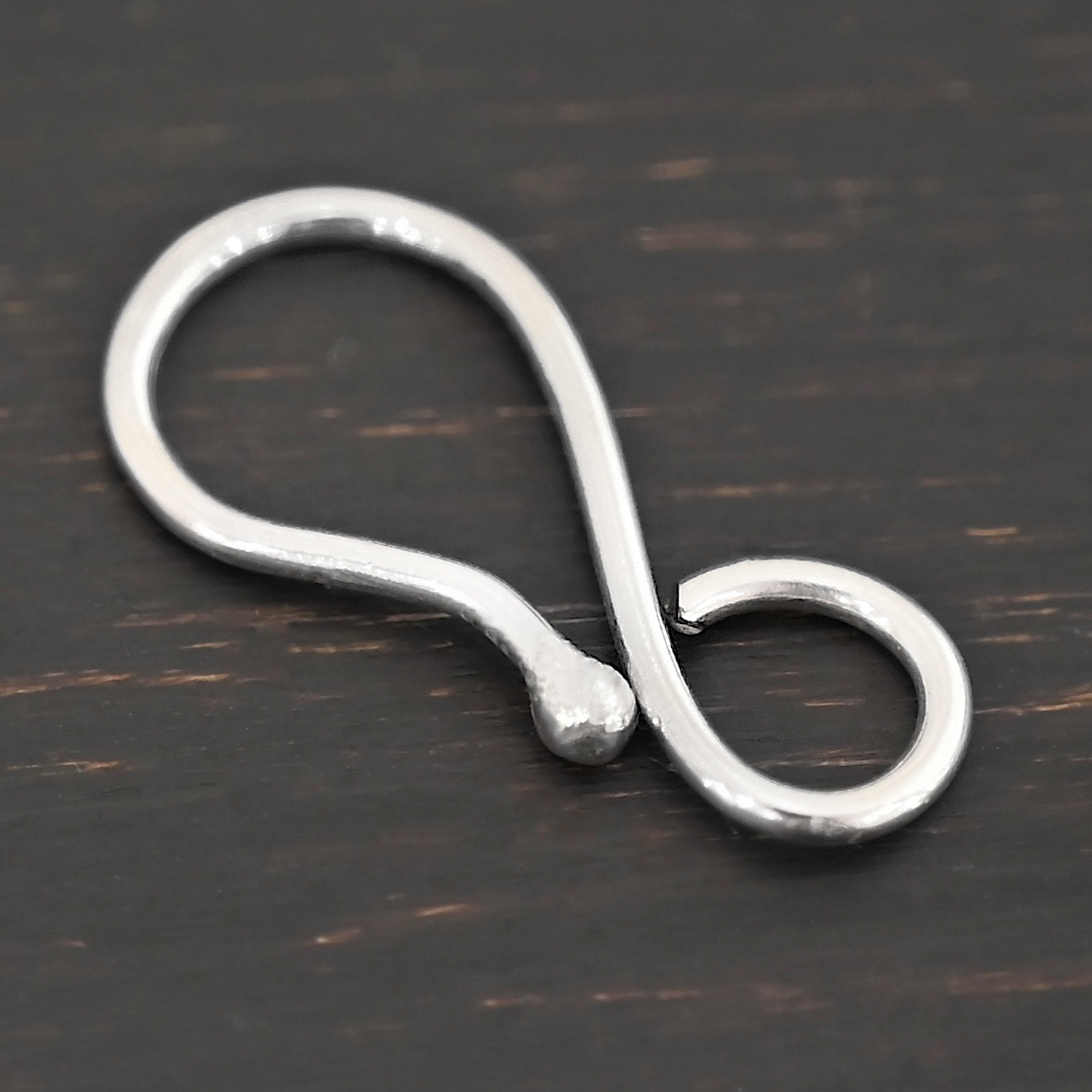 Hendrix Hook Clasp -shiny shown on dark background