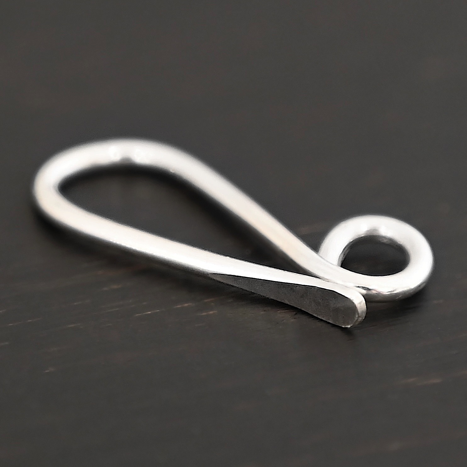 Hattie Hook Clasp - shiny Hattie Hook Clasp - shiny shown on dark background