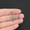 Hattie Hook Clasp - oxidized shown in hand
