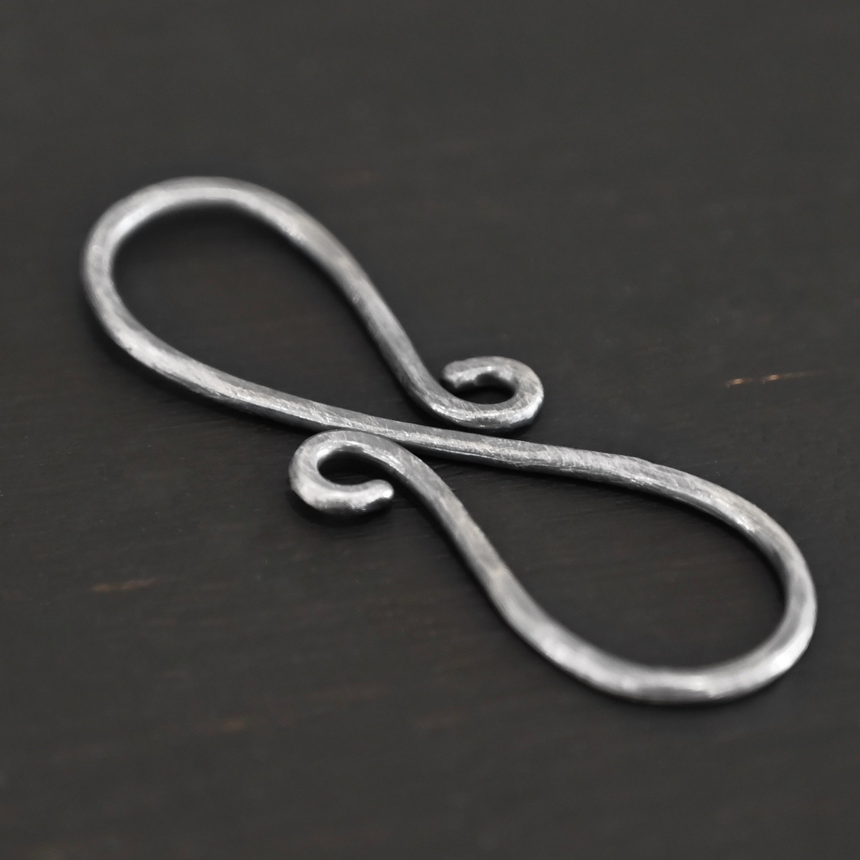 Summer S Clasp - oxidized hammered shown on dark background