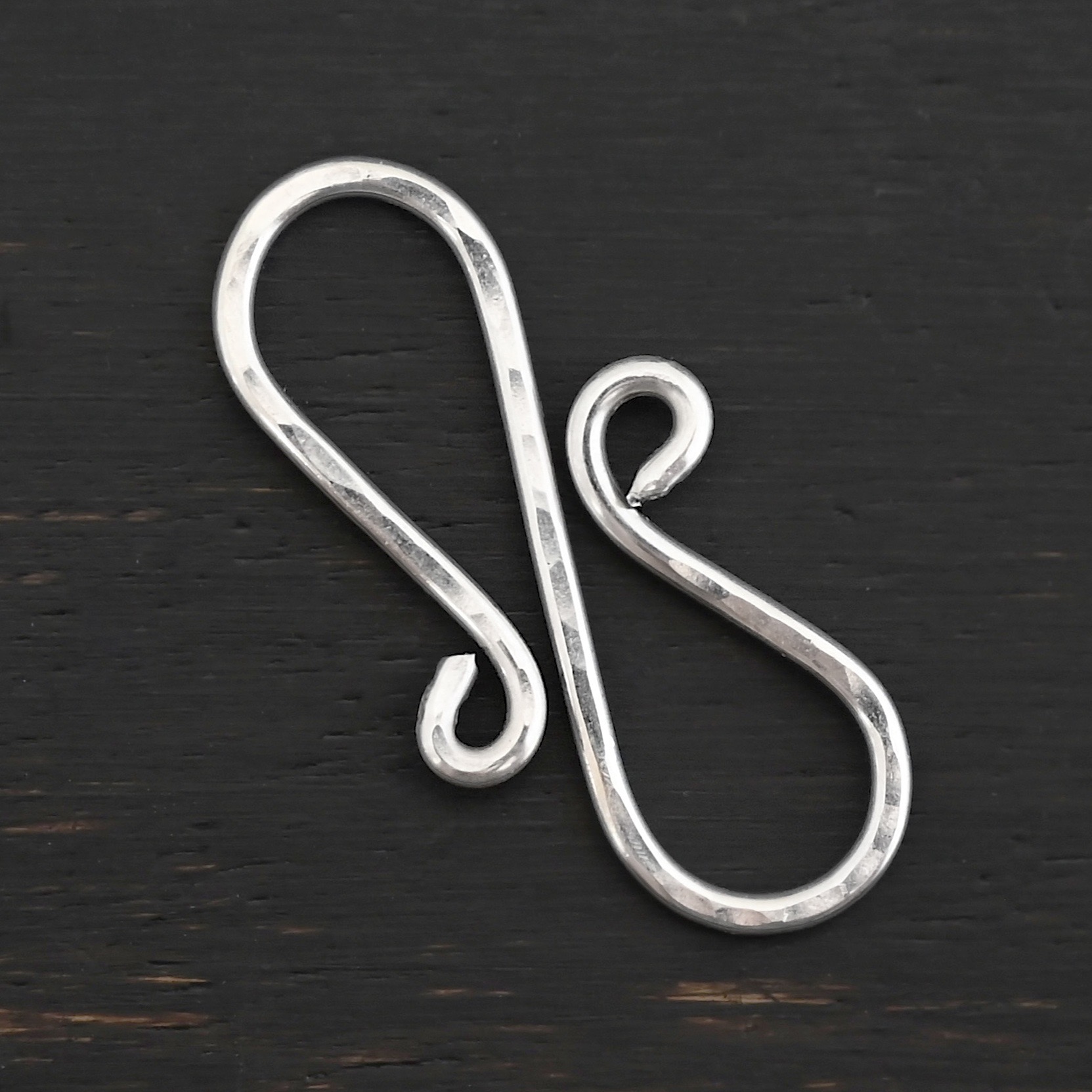 Summer S Clasp - shiny hammered shown on dark background