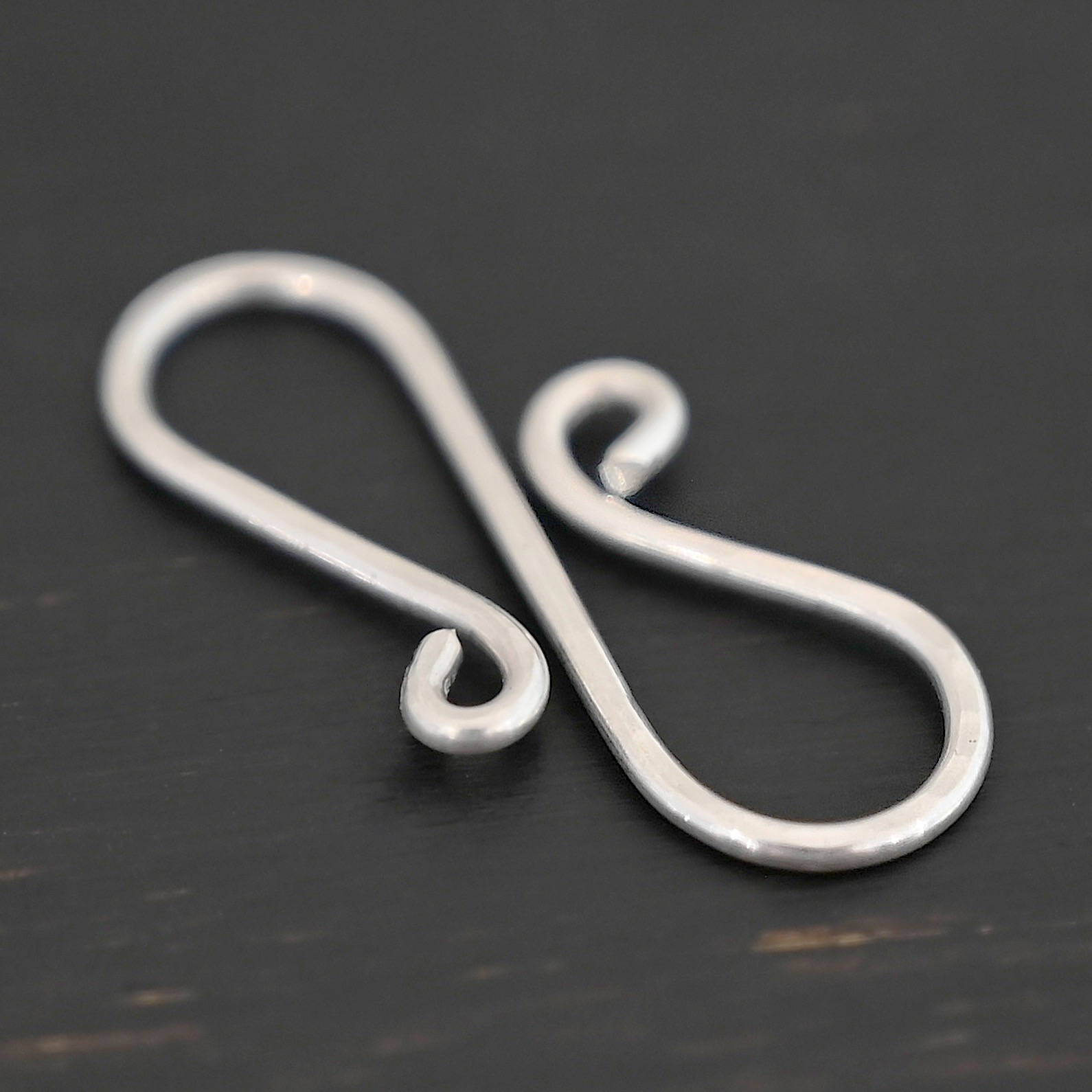 Summer S Clasp - shiny hammered shown on dark background