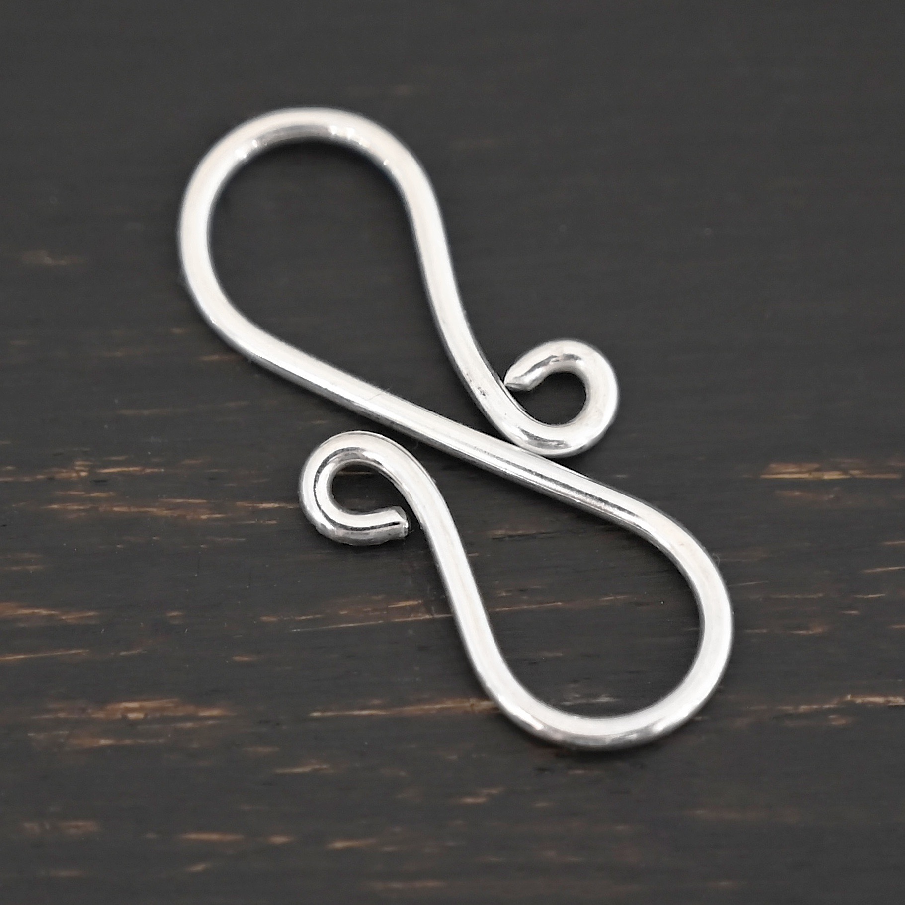 Summer S Clasp - shiny smooth shown on dark background