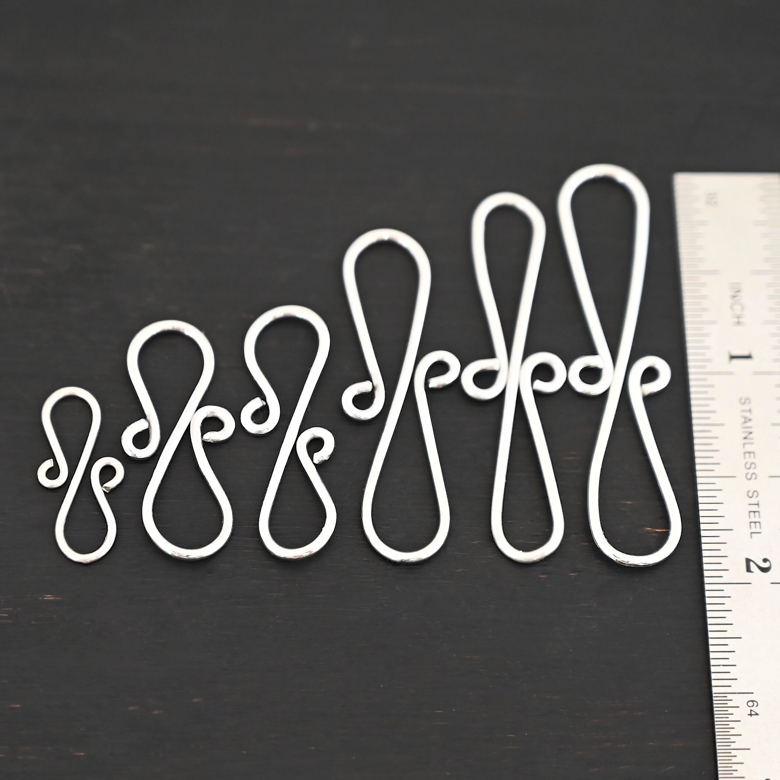 Summer S Clasp - shiny smooth shown by ruler