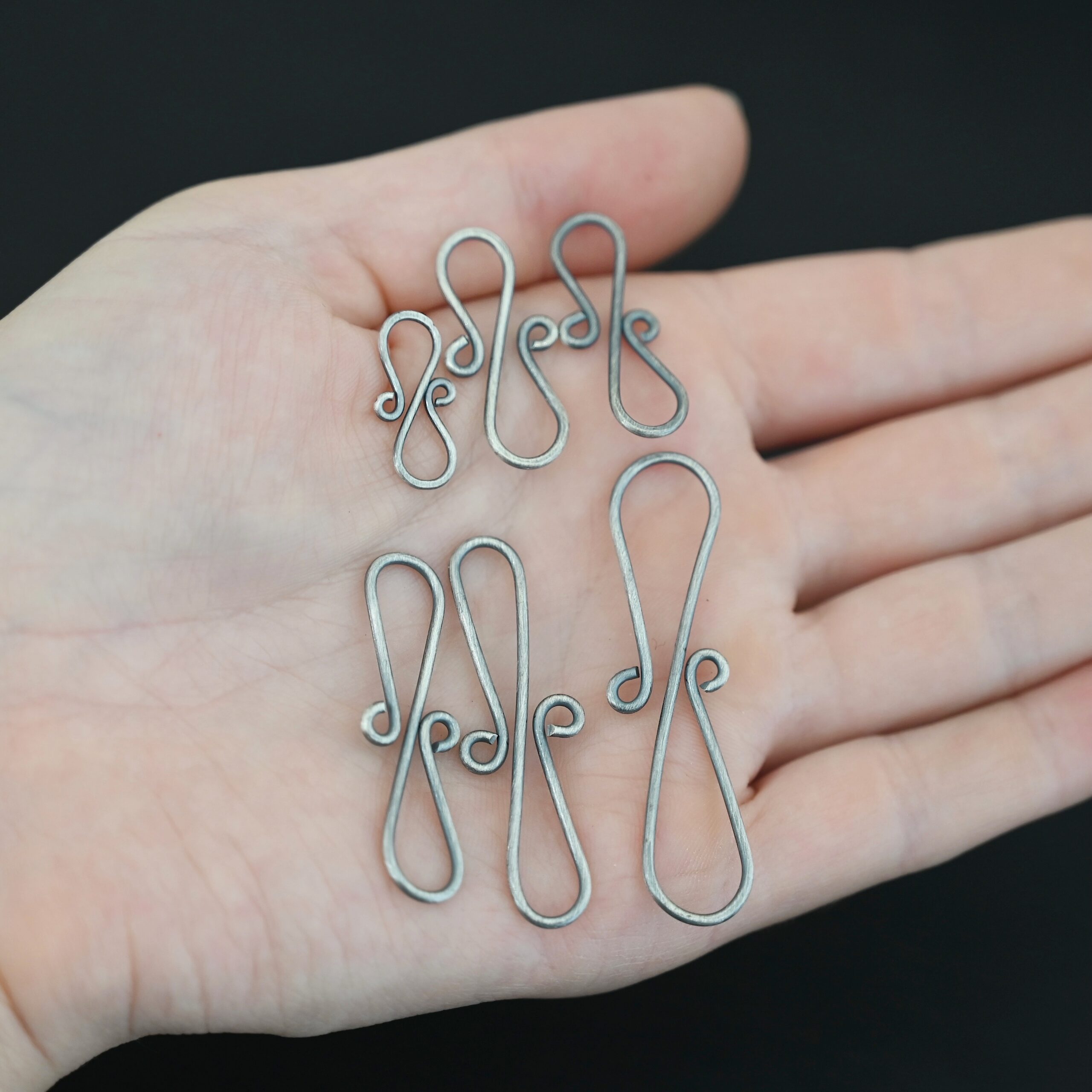 Summer S Clasp -oxidized smooth shown in hand