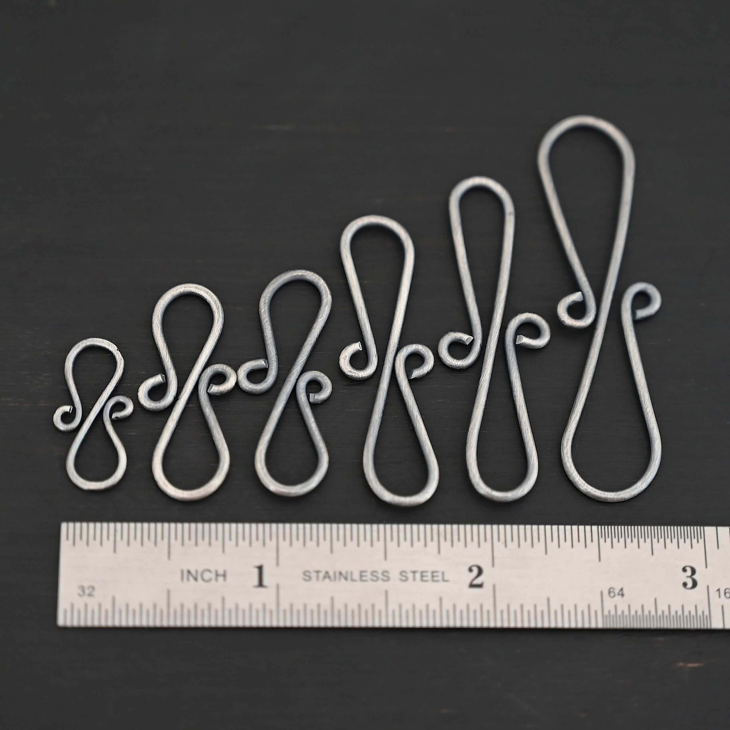 Summer S Clasp -oxidized smooth shown by ruler