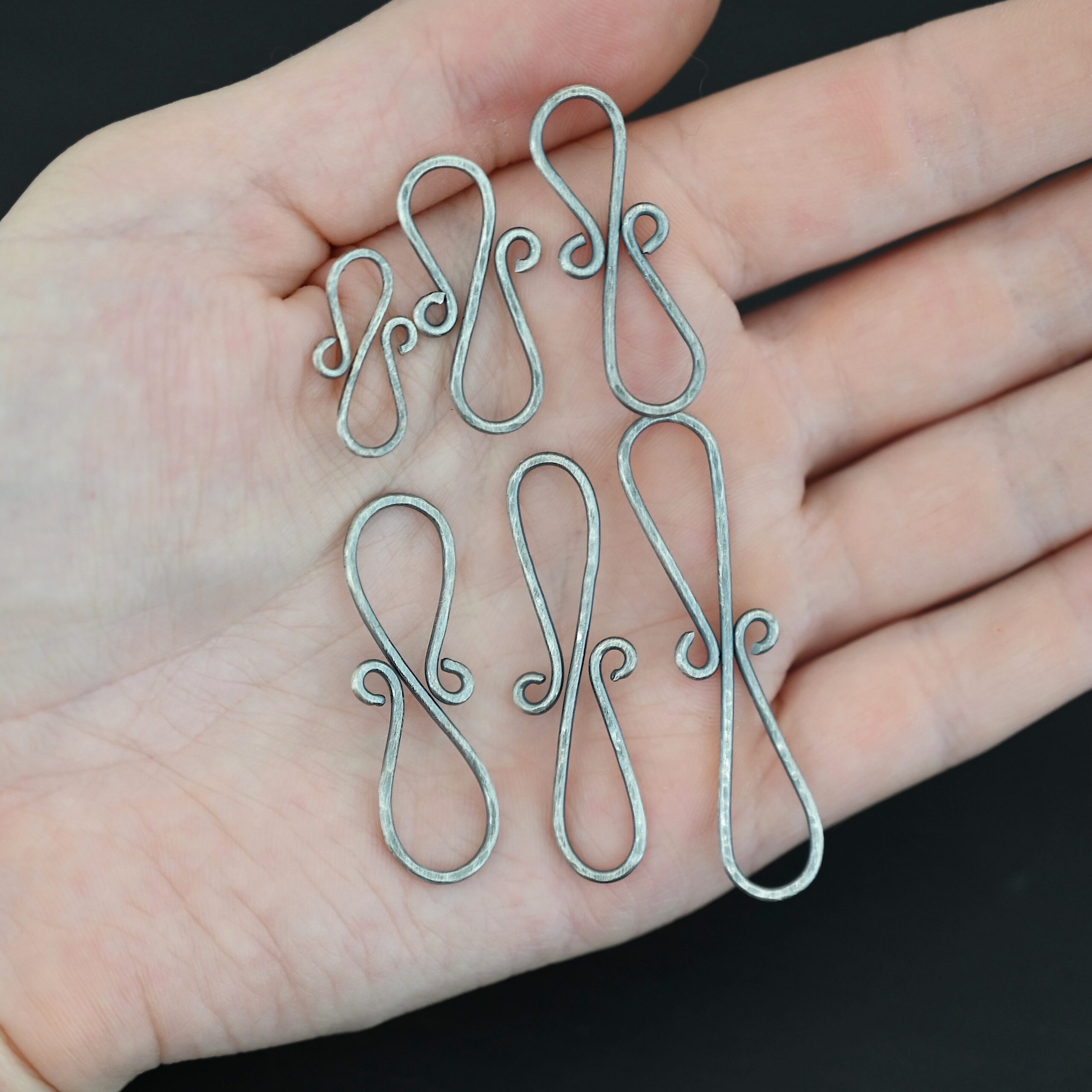 Summer S Clasp - oxidized hammered shown in hand