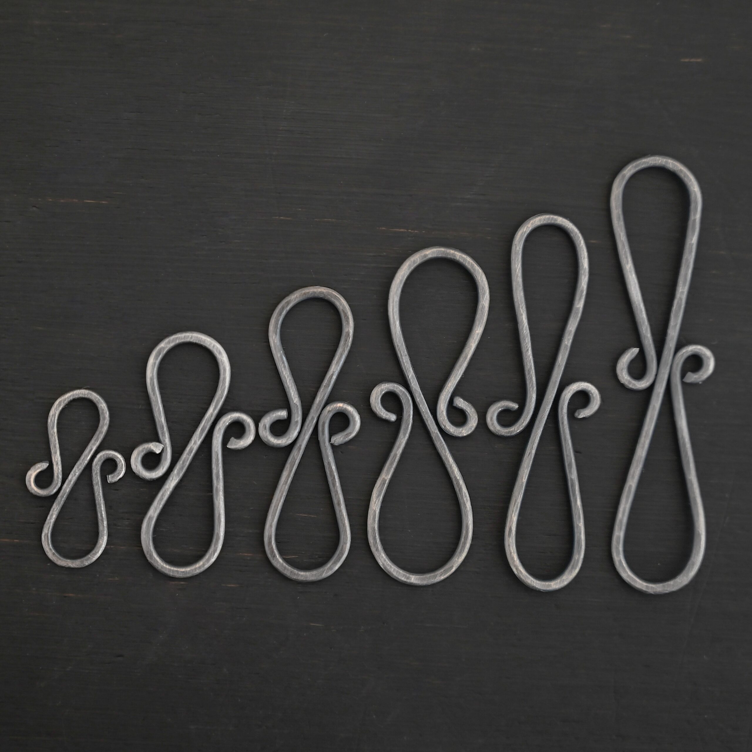 Summer S Clasp - oxidized hammered shown on dark background