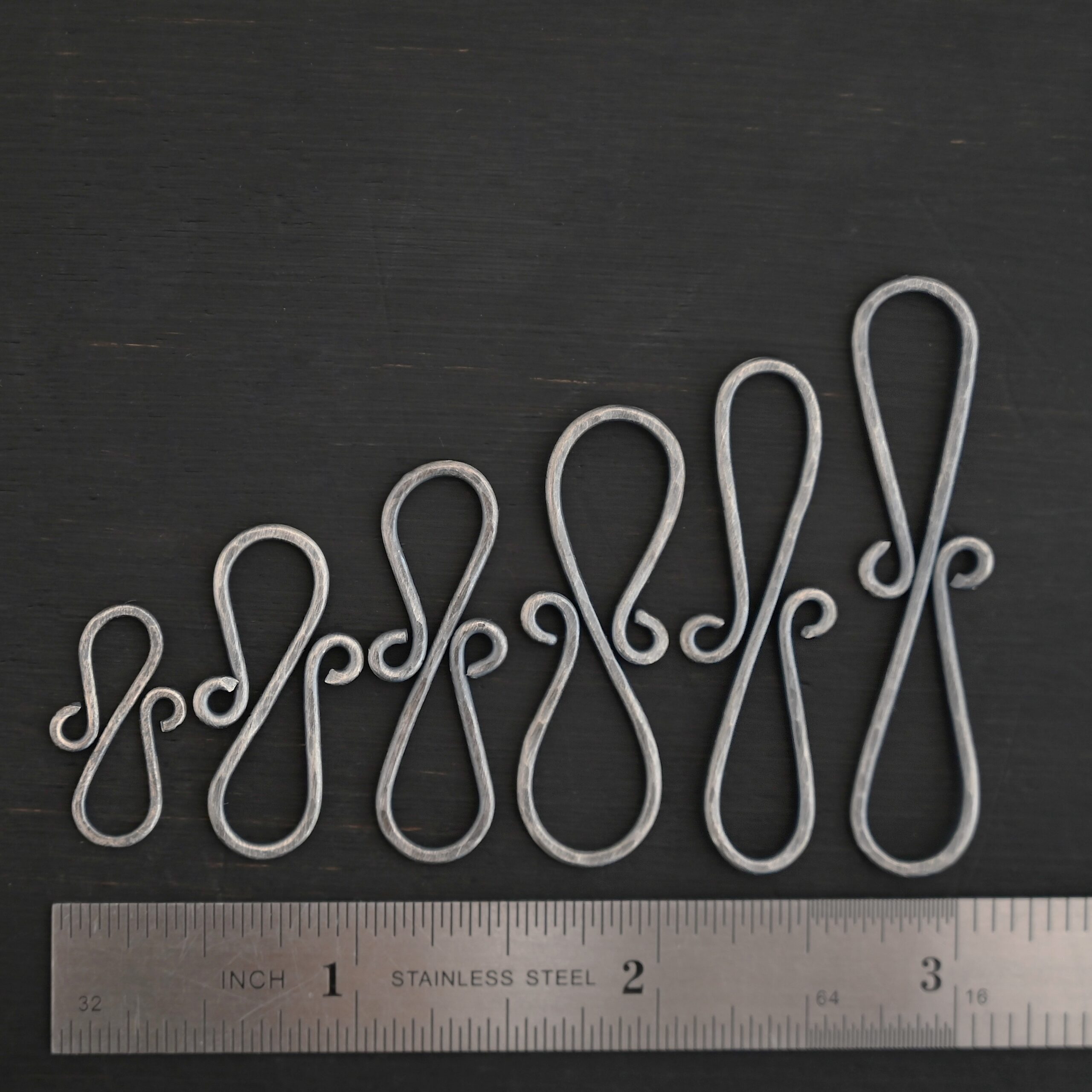 Summer S Clasp - oxidized hammered shown by ruler