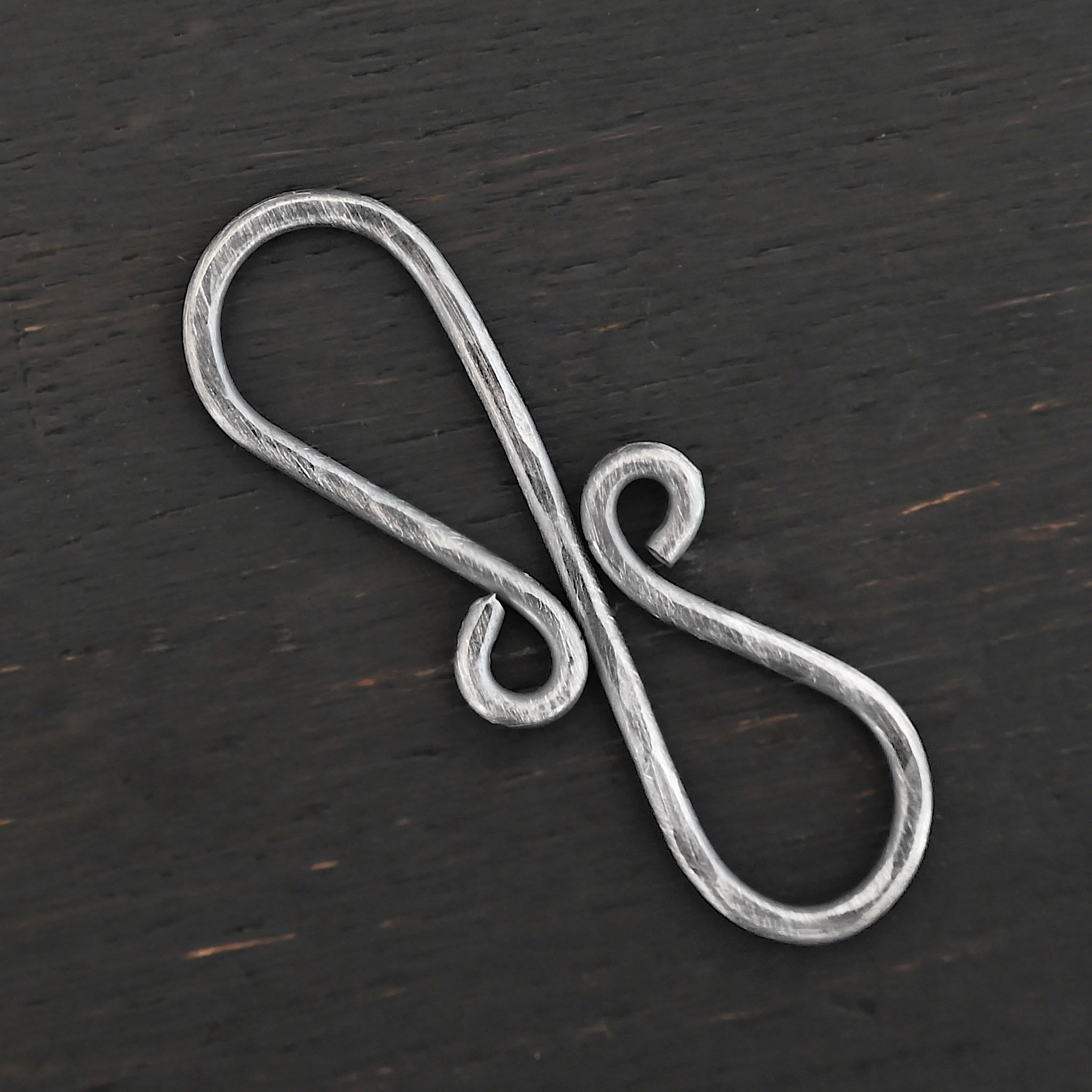 Summer S Clasp - oxidized hammered shown on dark background