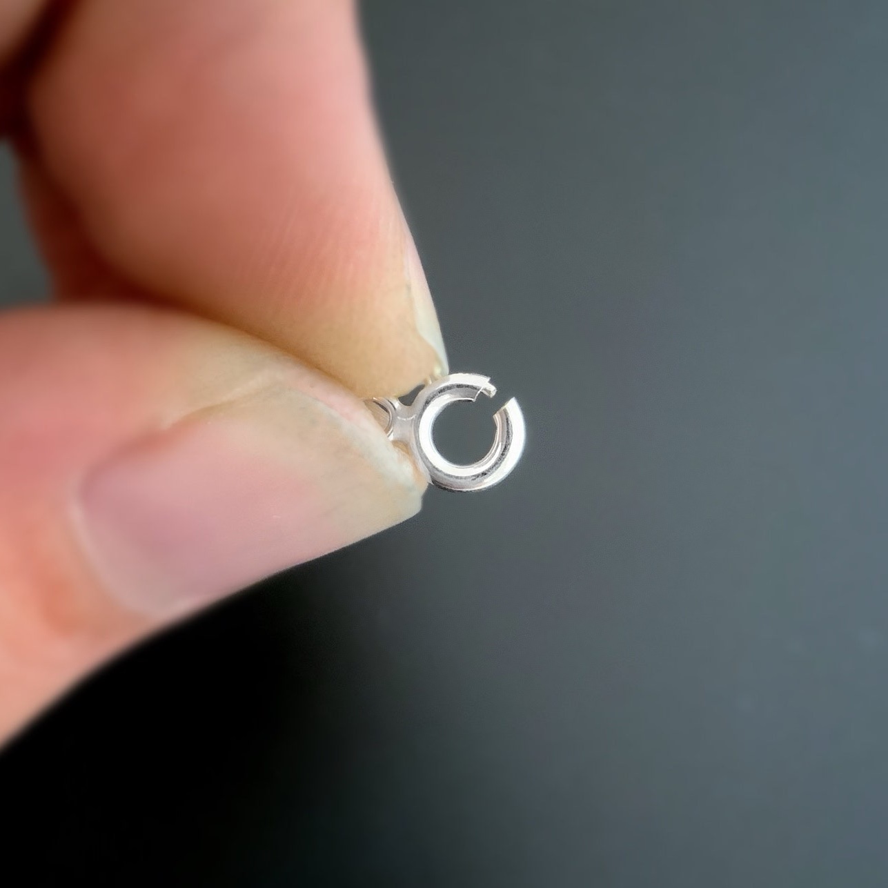 Sky Spring Ring Clasps - shiny shown in hand