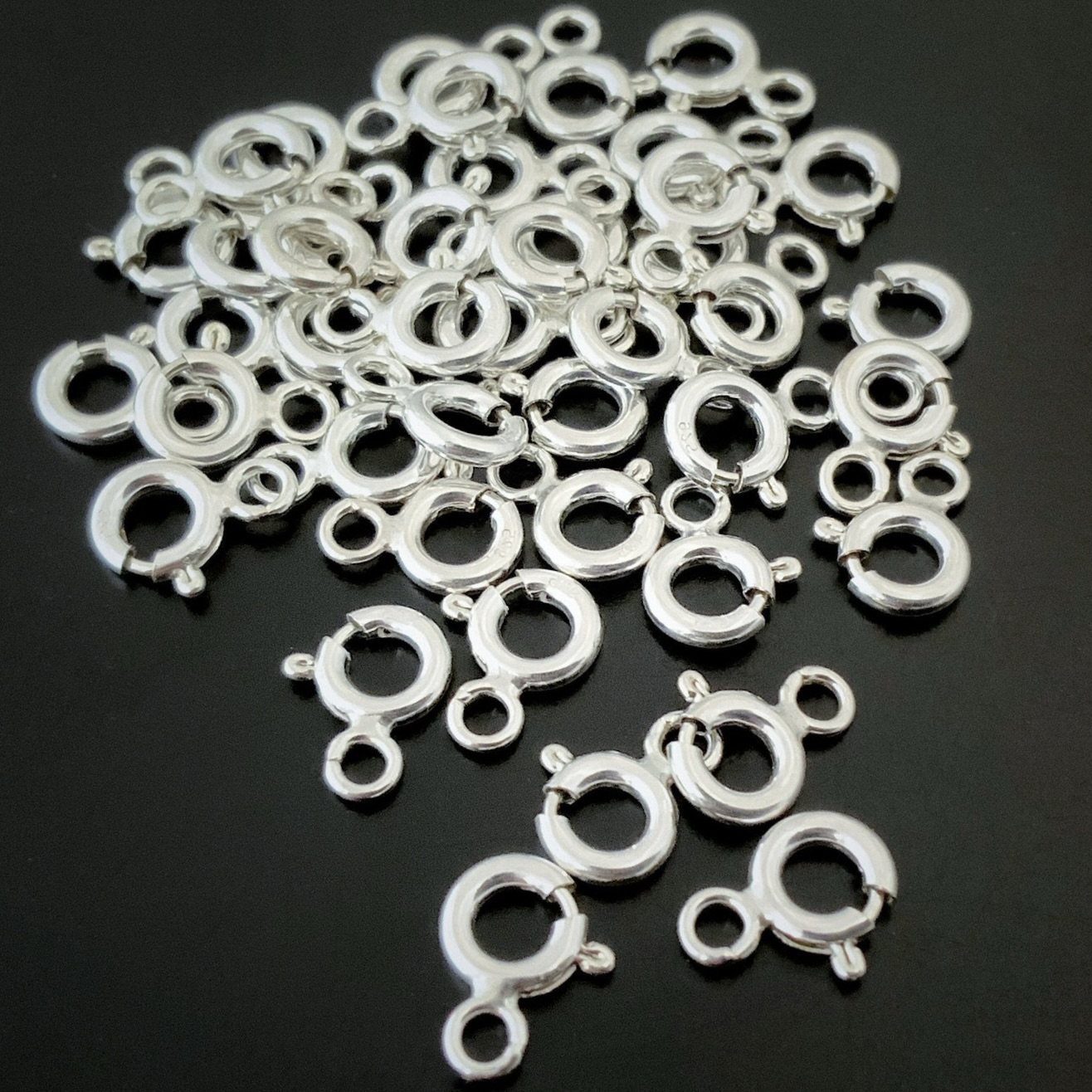 Sky Spring Ring Clasps - shiny shown on dark background