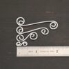 Hammered Swirl Finding - shiny shown by ruler