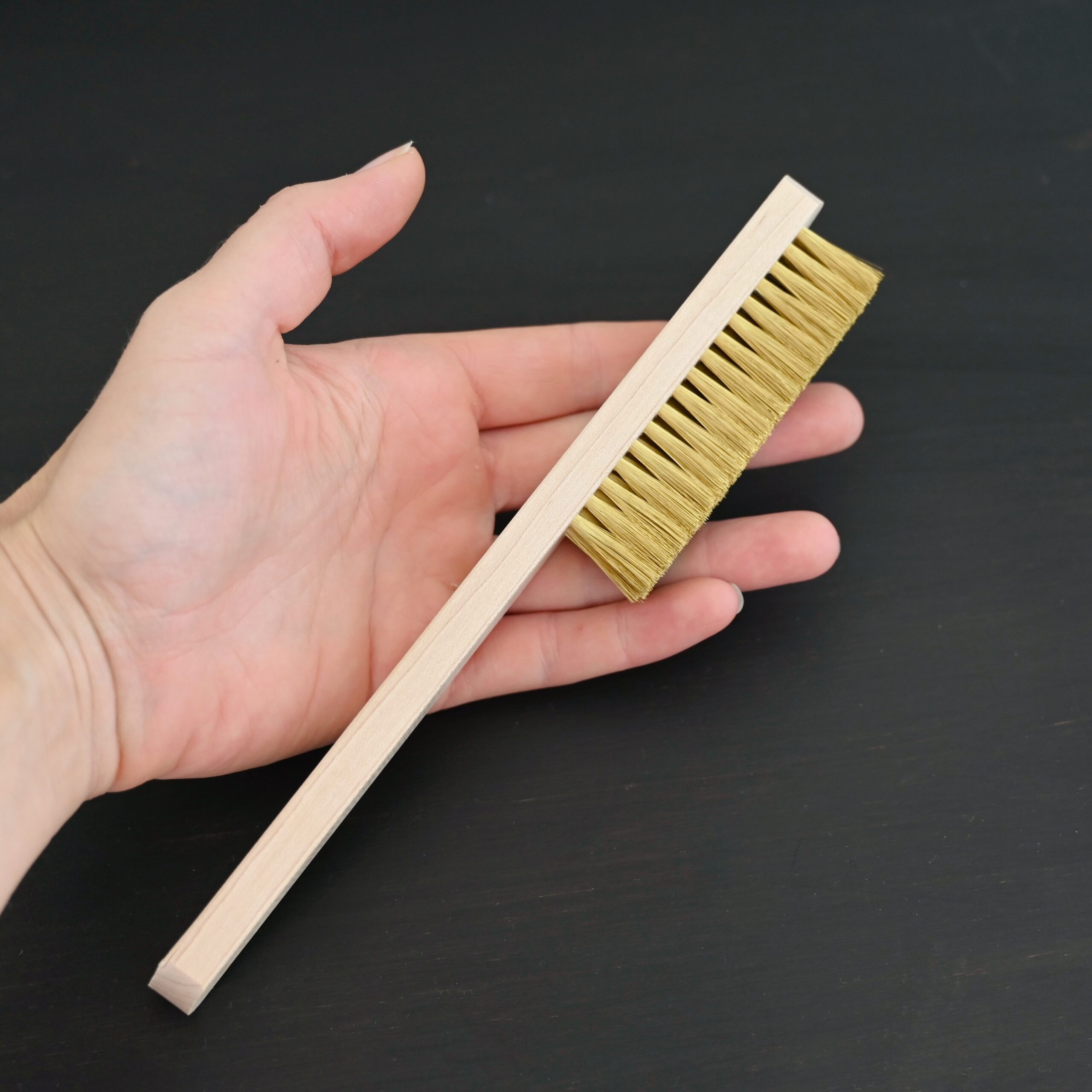 Brass Brush shown in hand