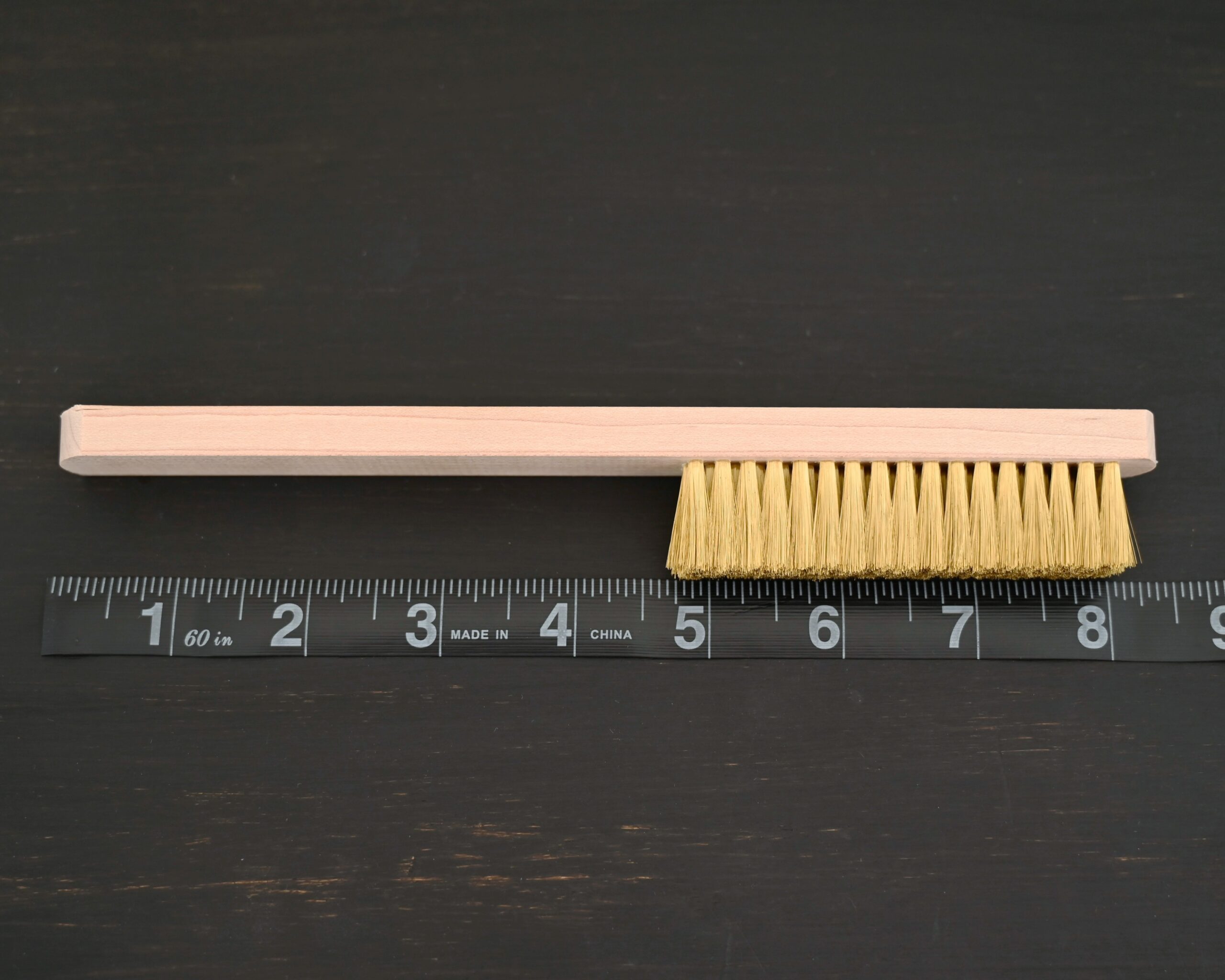 Brass Brush shown by ruler