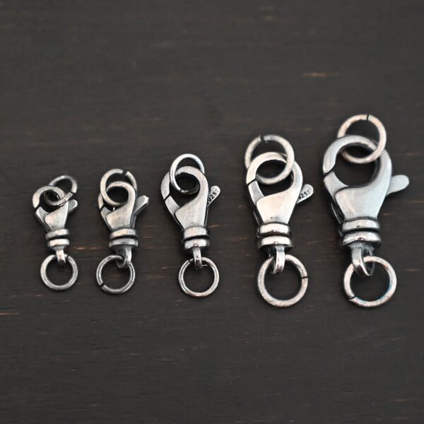 Sammy Swivel Lobster Claw - oxidized open shown on dark background